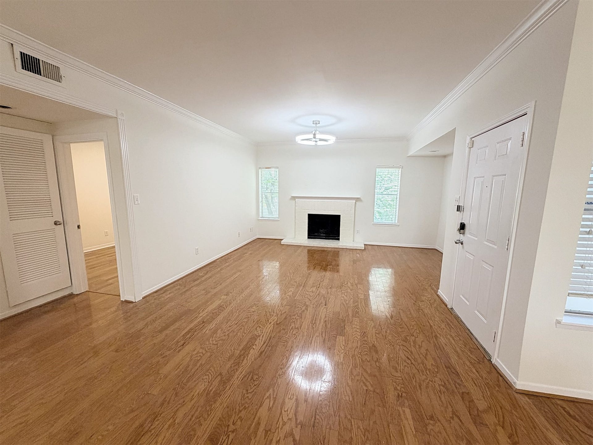 The gleaming wood floors greet you as you enter the door.