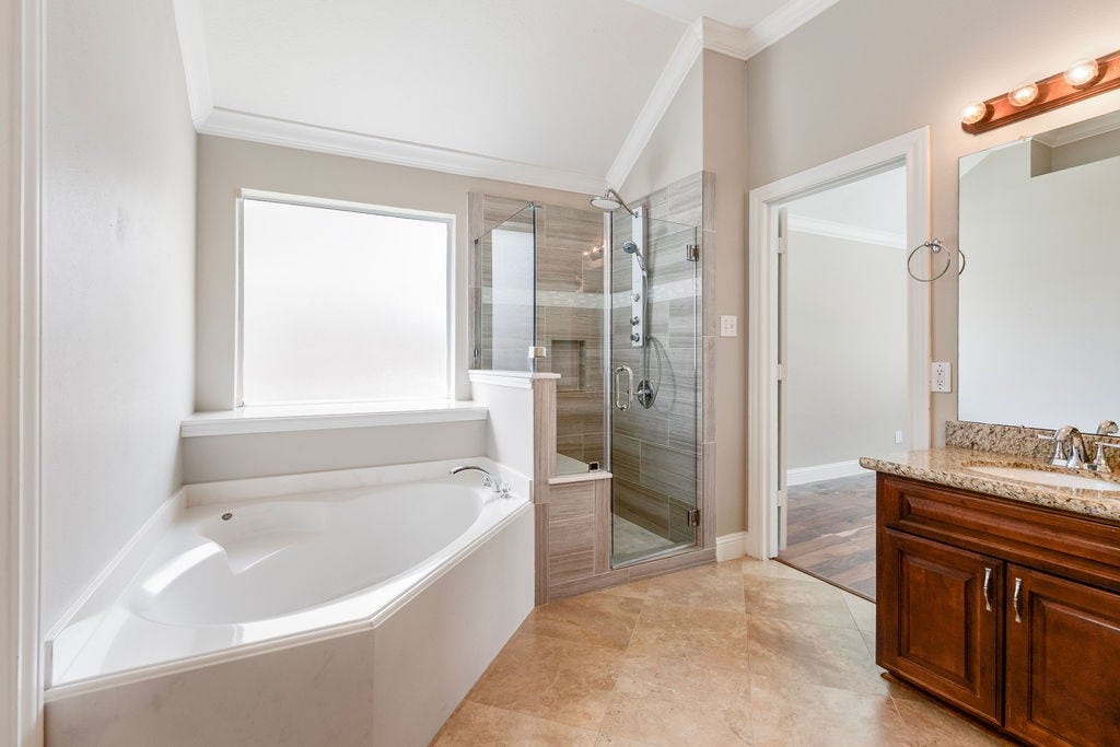 MASTER BATH WITH SEPARATE SHOWER WITH SEAT.GARDEN SOAKER TUB.BEAUTIFUL
VANITYWITH TWO SINK