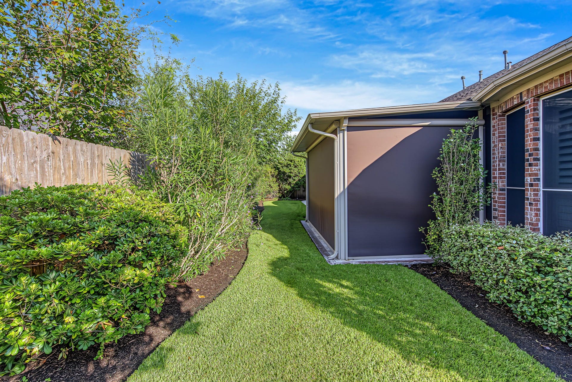 12619 Mossy Ledge Drive, Tomball, TX 77377 View of backyard with privacy screens down