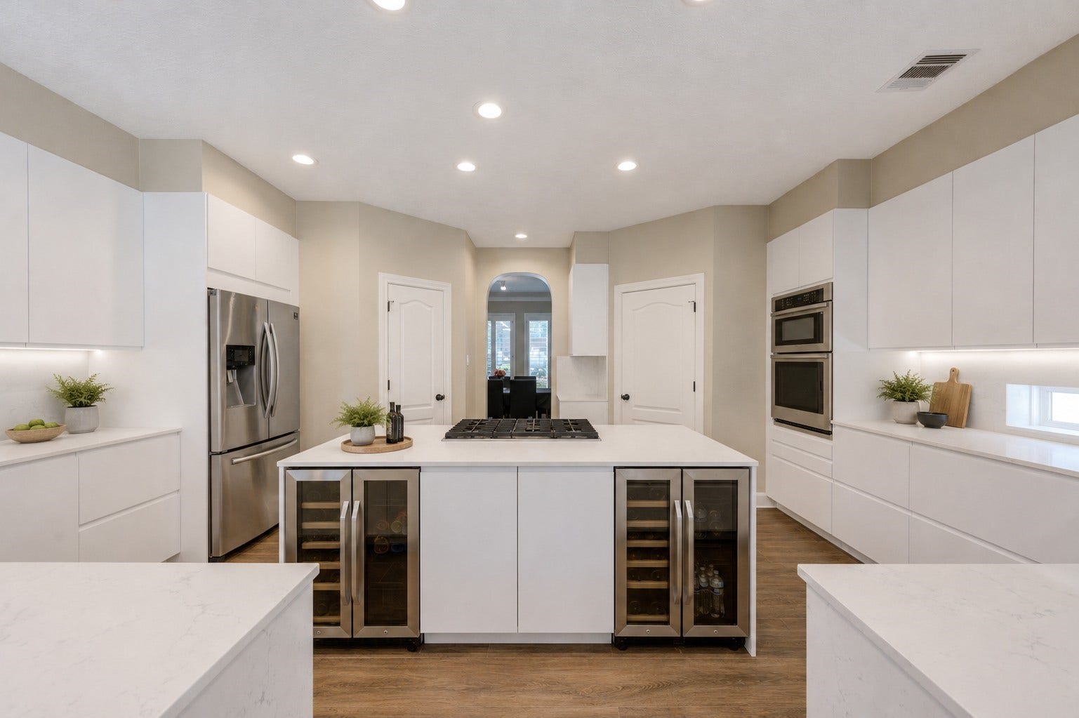 12806 Rock Falls Way, Houston, TX 77041 Experience culinary luxury in this renovated kitchen with custom cabinetry, quartzite countertops, a stylish tile backsplash, dual wine chillers, and sleek stainless steel appliances.