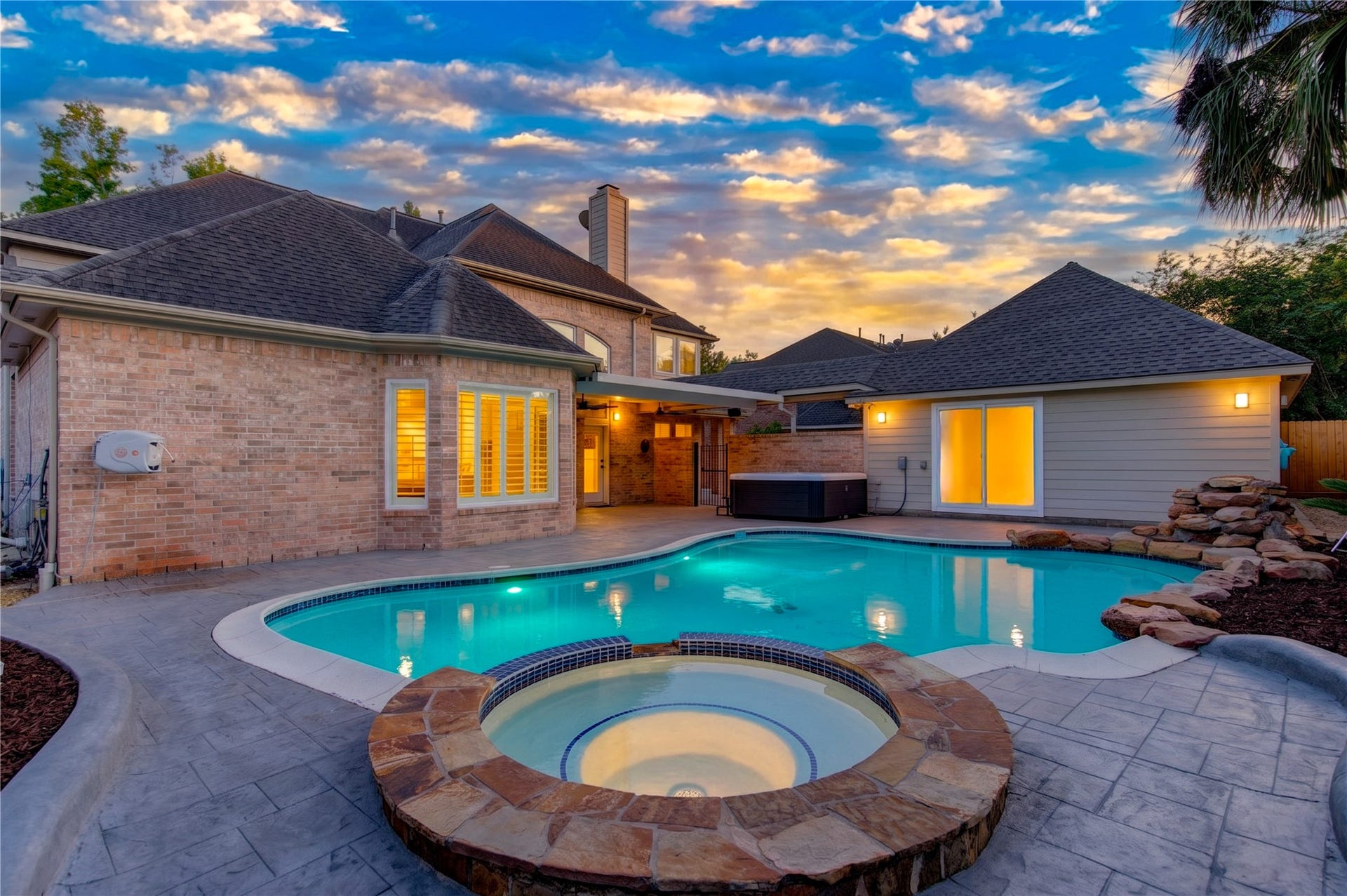 12806 Rock Falls Way, Houston, TX 77041 Spacious pool with an expansive patio, perfect for outdoor relaxation and entertaining.