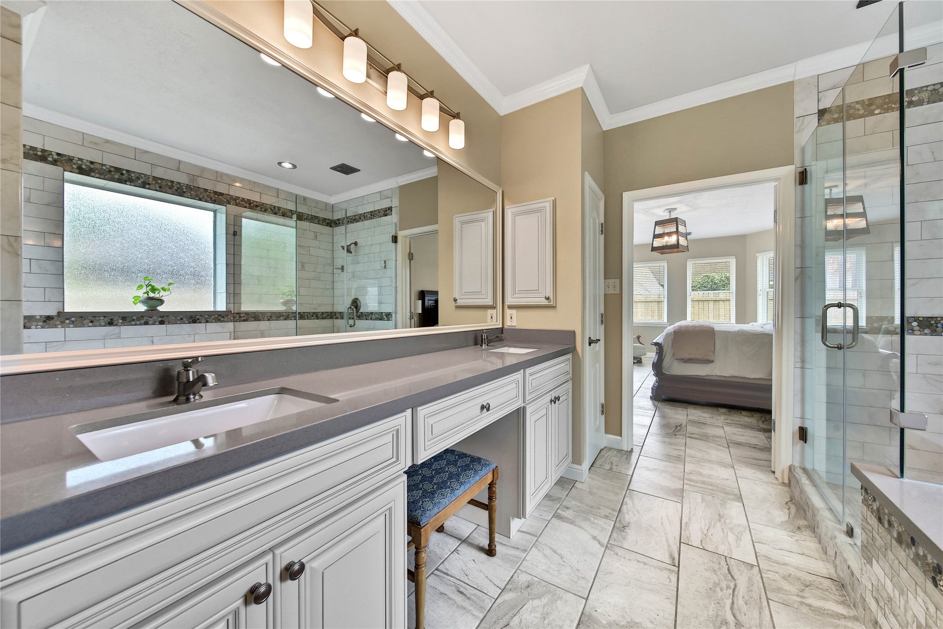 Completely remodeled primary bath delivers! With ample countertop, Double Sinks, Vanity area, Huge Mirror, Oversize Shower, Garden Tub, and HUGE adjacent Walk-In-Closet!