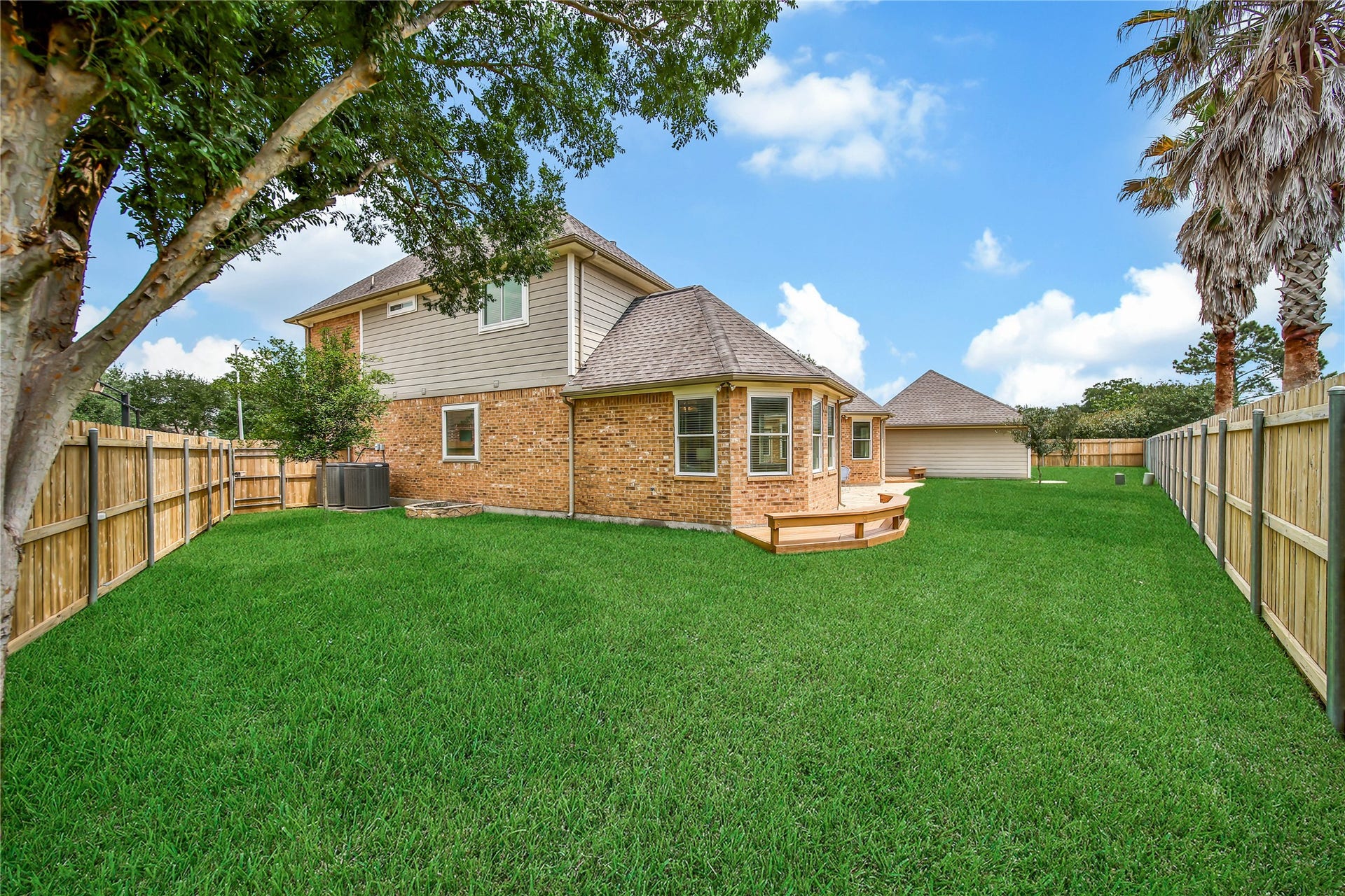 This lot has a large backyard and 2 huge side yards! There is something for everyone here! Deck wraps around from the back patio around the primary bedroom.