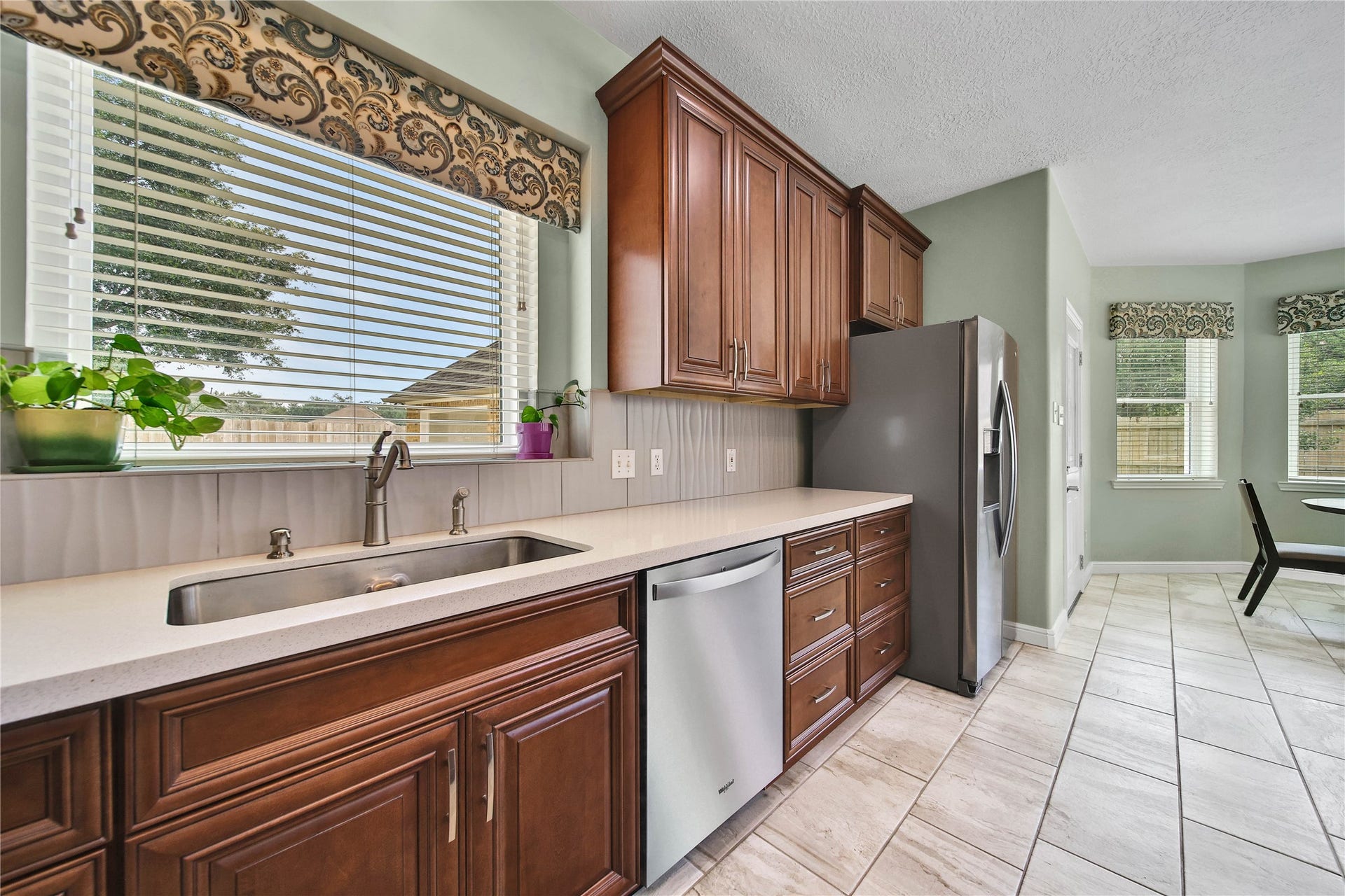 Completely updated kitchen includes cabinetry with soft close doors and drawers. Bright sunny window over the kitchen sink.