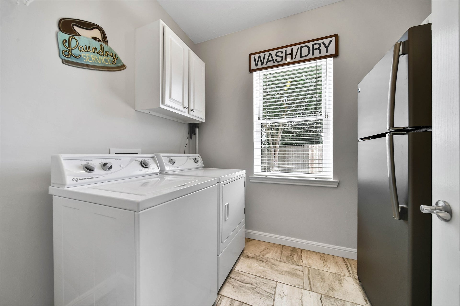 Functional Laundry room is conveniently located in the heart of the work zone in this home.