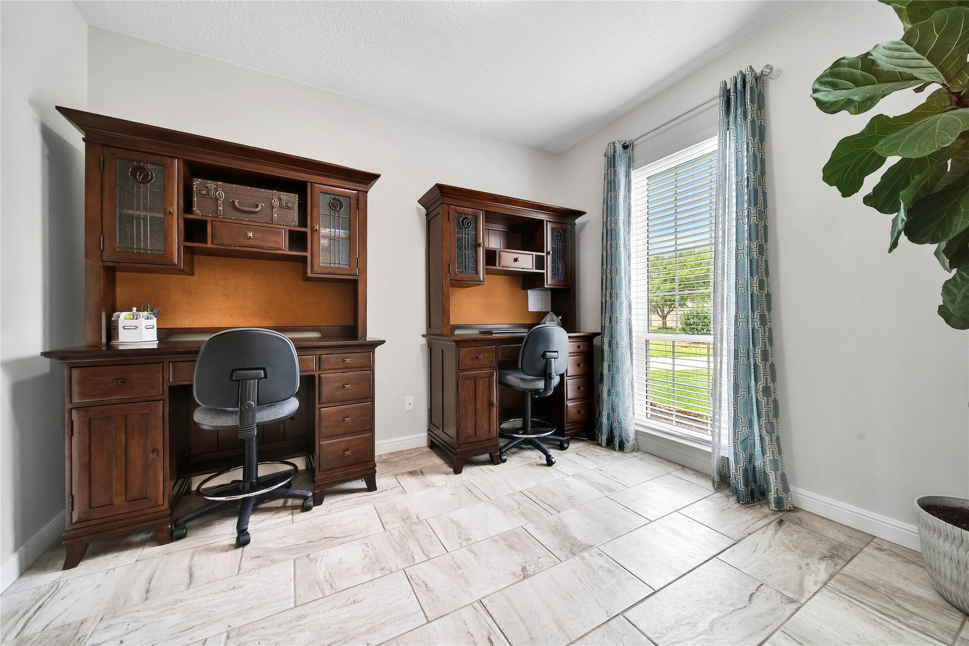 Spacious enough for 2 work stations or your large office pieces, this private study is a perfect place to be productive.