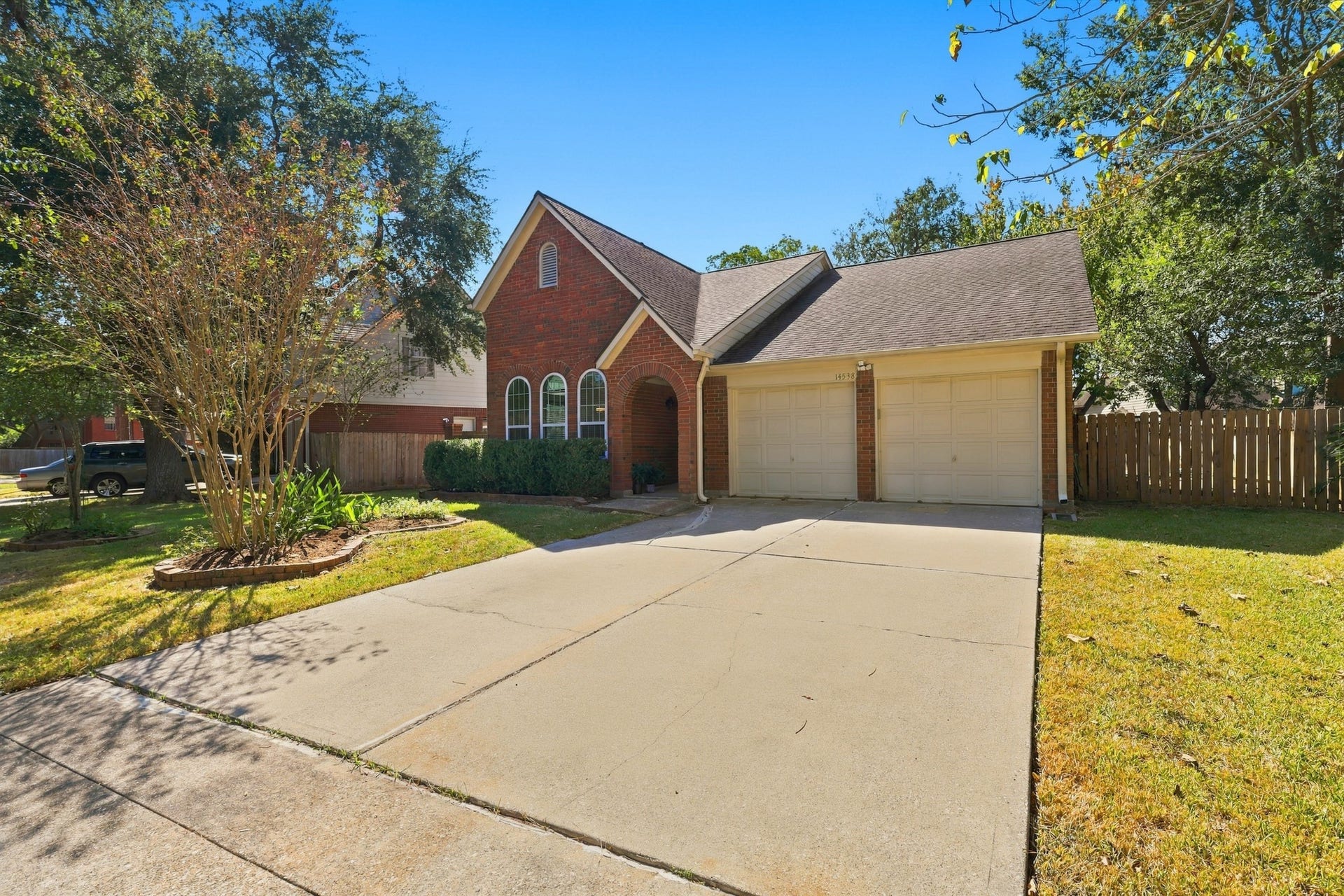 14538 Circlewood Way, Houston, TX 77062 You will love this home's attractive brick exterior, distinctive arched windows, welcoming covered entry, and mature shade trees. Established landscaping, a generous driveway, and an attached two-car garage add to the home's curb appeal and everyday convenience.