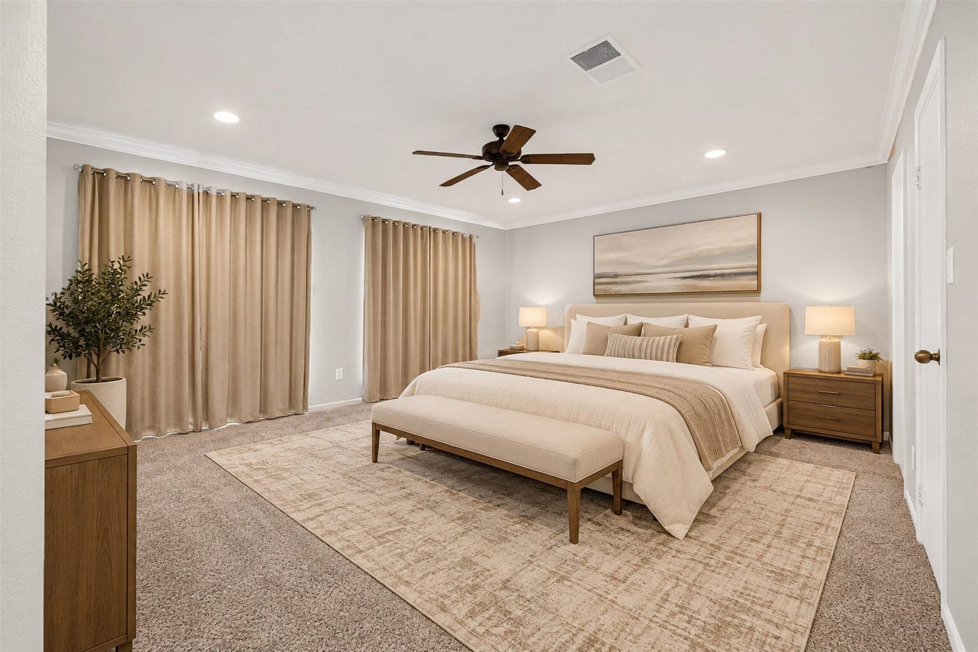 2379 Briarwest Boulevard, #85, Houston, TX 77077 Virtually staged as a serene retreat, the primary bedroom fits a king bed with bench, matching nightstands, and a dresser with ease. Carpet underfoot, a ceiling fan above, and curtains drawn across two walls.