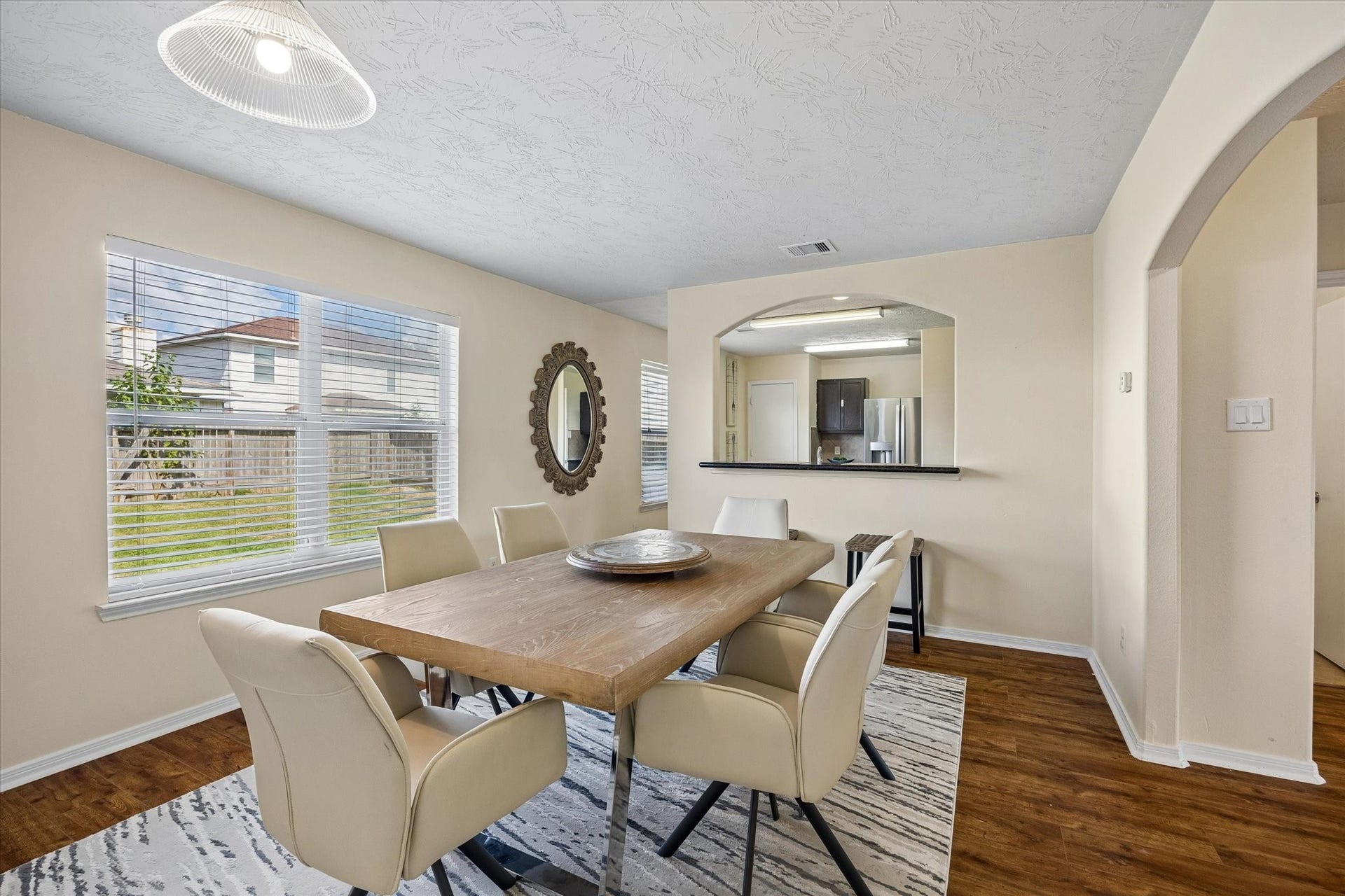 2130 Summit Meadow Drive, Houston, TX 77489 Bright and inviting dining area, with large windows, modern lighting, and an open layout perfect for family gatherings