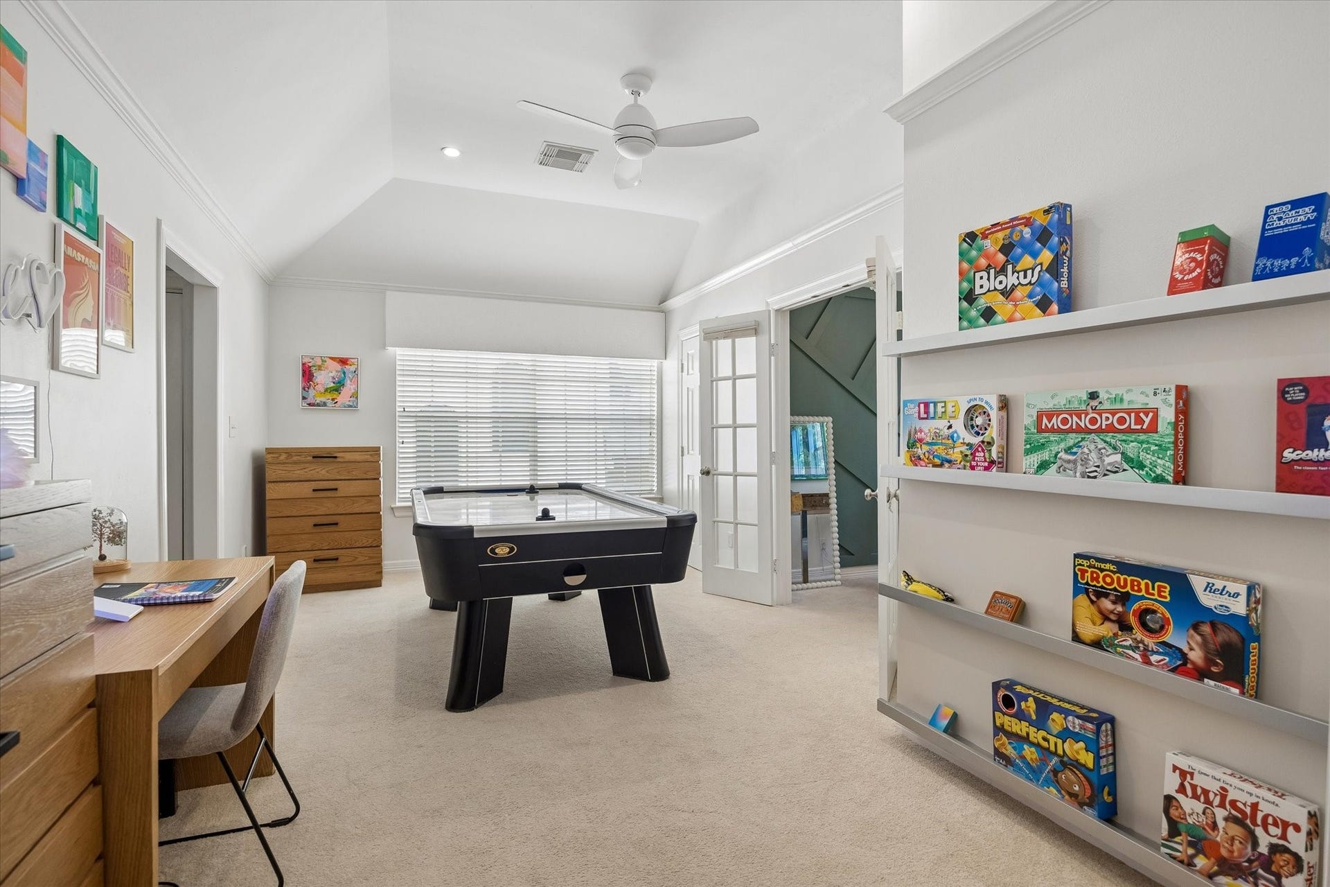 This game room has a large east facing window and acts as the ideal space for arts & crafts projects, reading and simply being a kid.