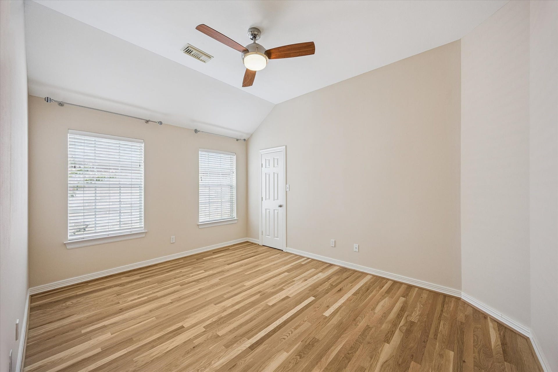 Here is an image of one of the three secondary bedrooms which shows of the brand new hardwood floors.