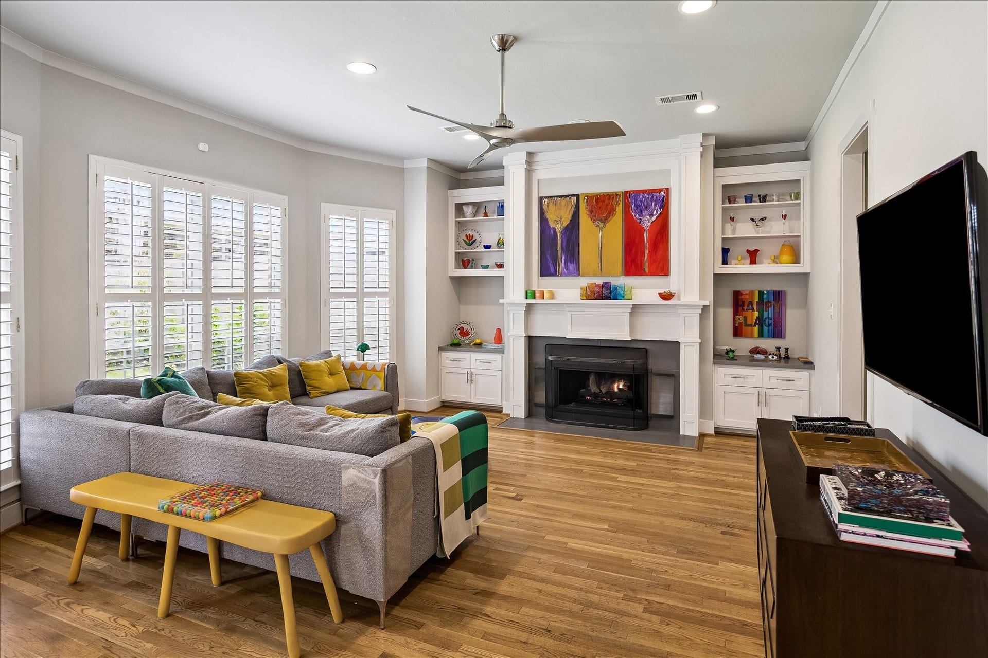 Anchored by a pair of built-ins is a gas log fireplace.  Handsomely stained 2 1/4" oak floors run throughout the first floor.