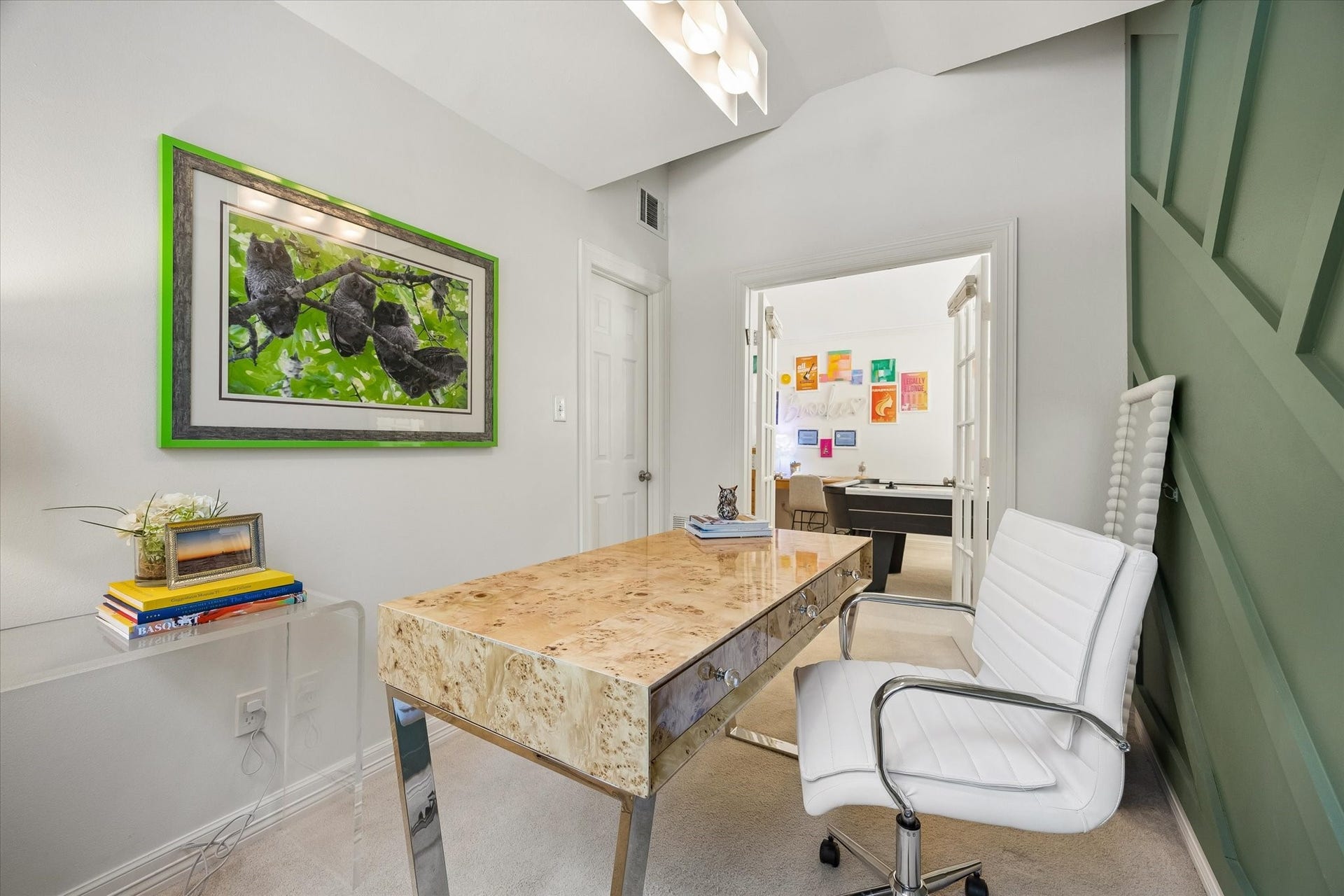 Previously utilized as a bedroom, the wardrobe closet is located behind the door to to the left of the French doors.