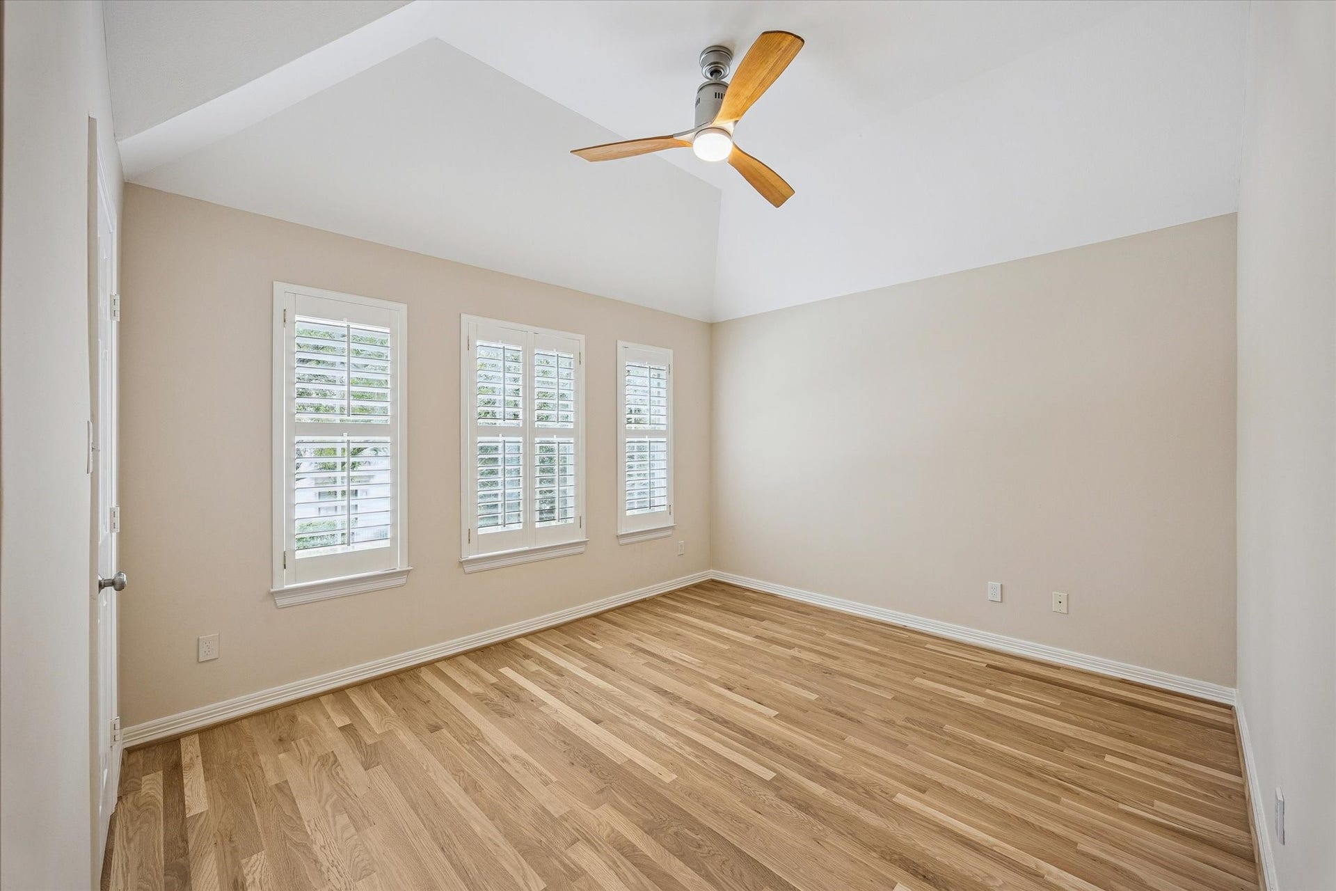 Here is an image of one of the three secondary bedrooms which shows of the brand new hardwood floors.