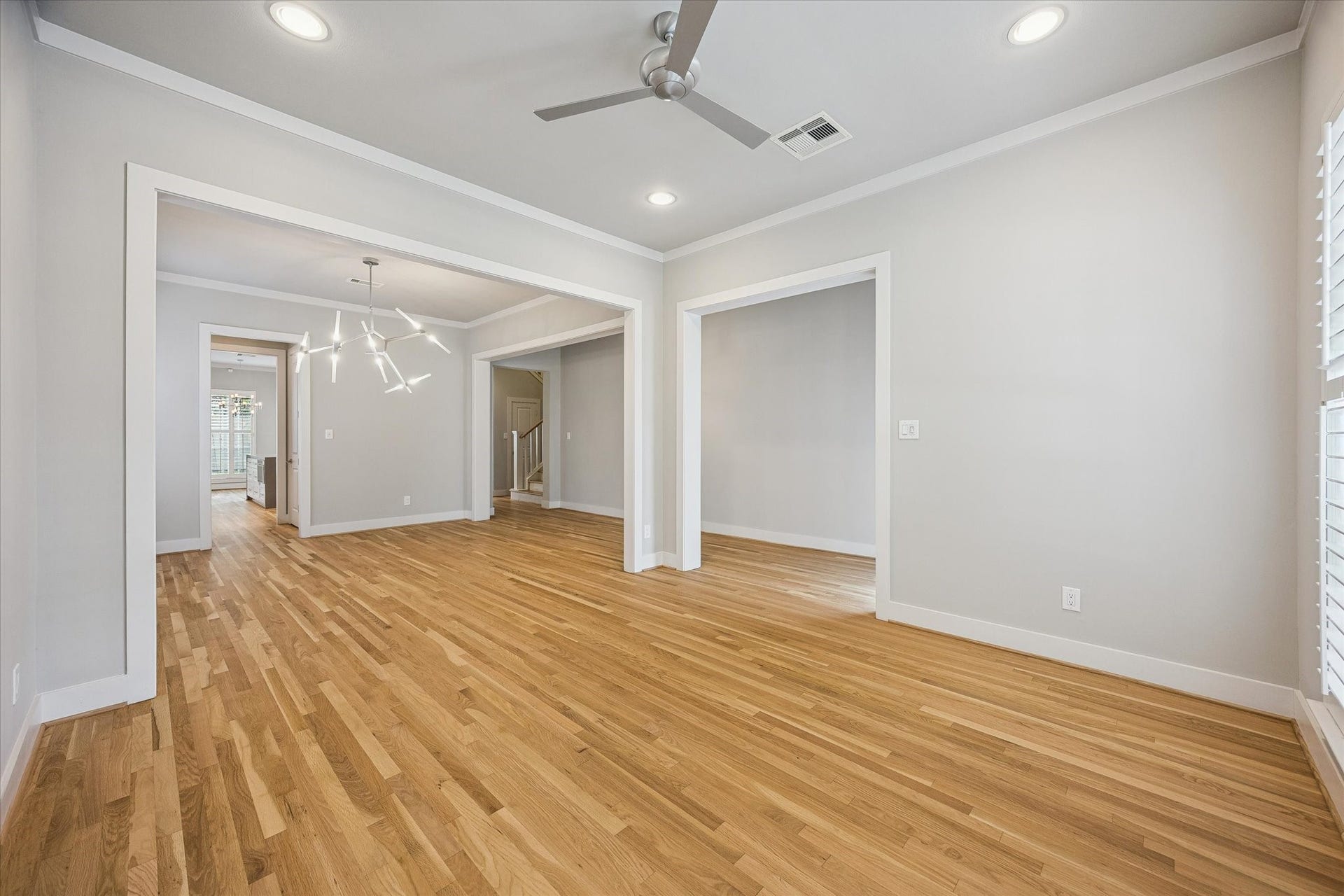 Here is a view of the front sitting room and how it connects with the rest of the home.  Just beyond the cased opening is the dining room.