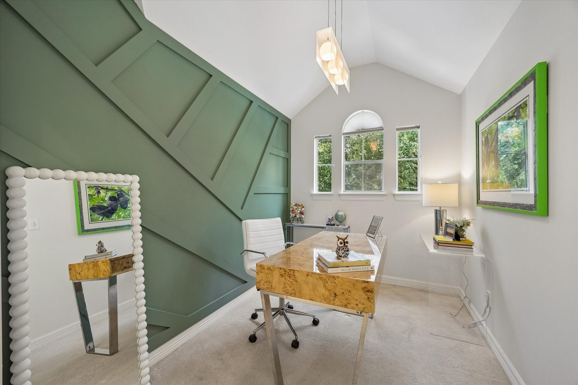 Currently staged as a home office, this room is located off of the game room with south facing windows with 'tree house' views.