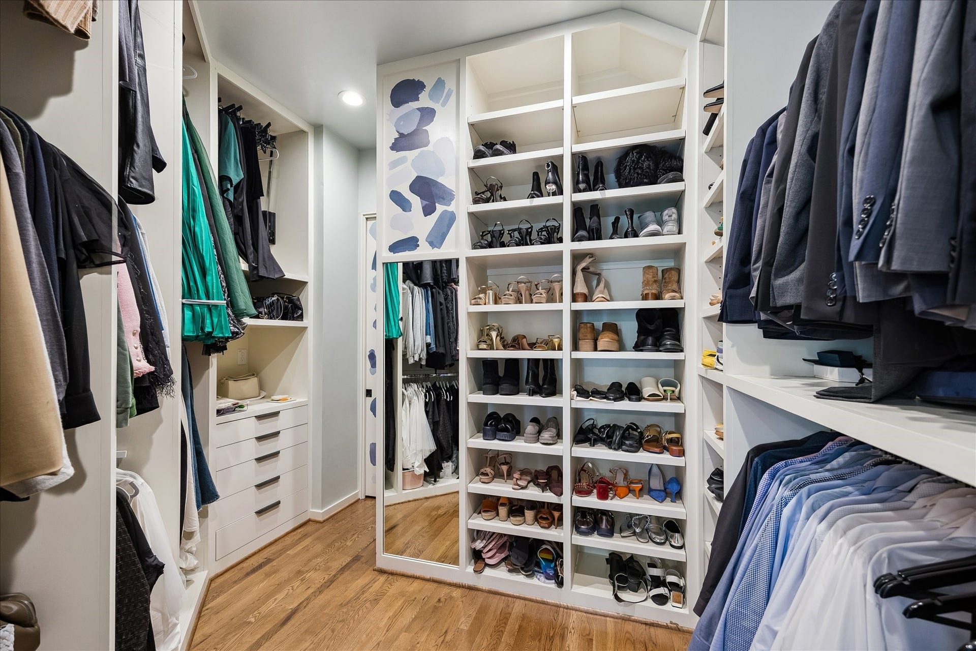 The wardrobe closet has an abundance of storage for even the biggest clothing aficionado.