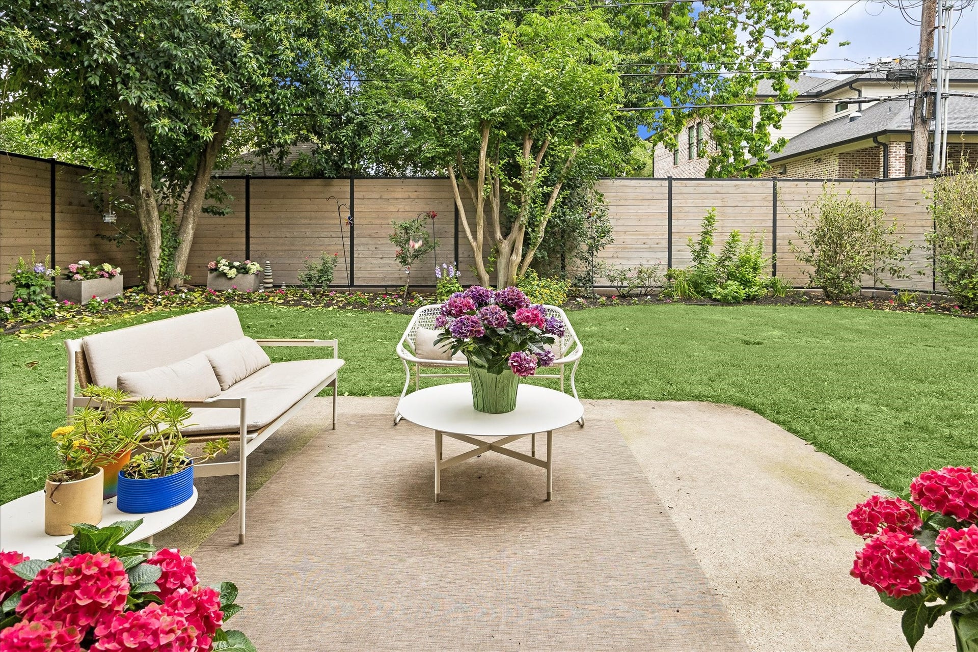 Steel framing and horizontal cedar pickets create a fence that is more of a work of art.