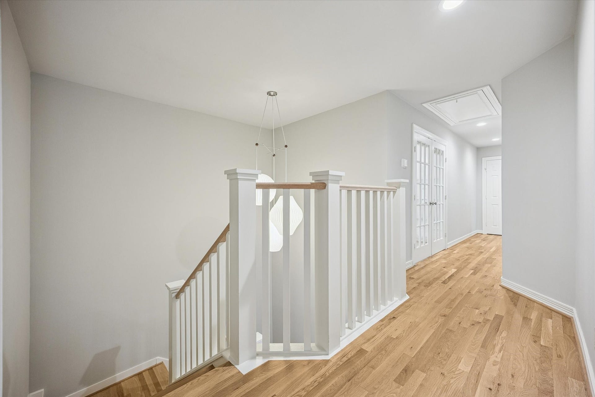 The stair hall leads to the game room and three additional bedrooms.