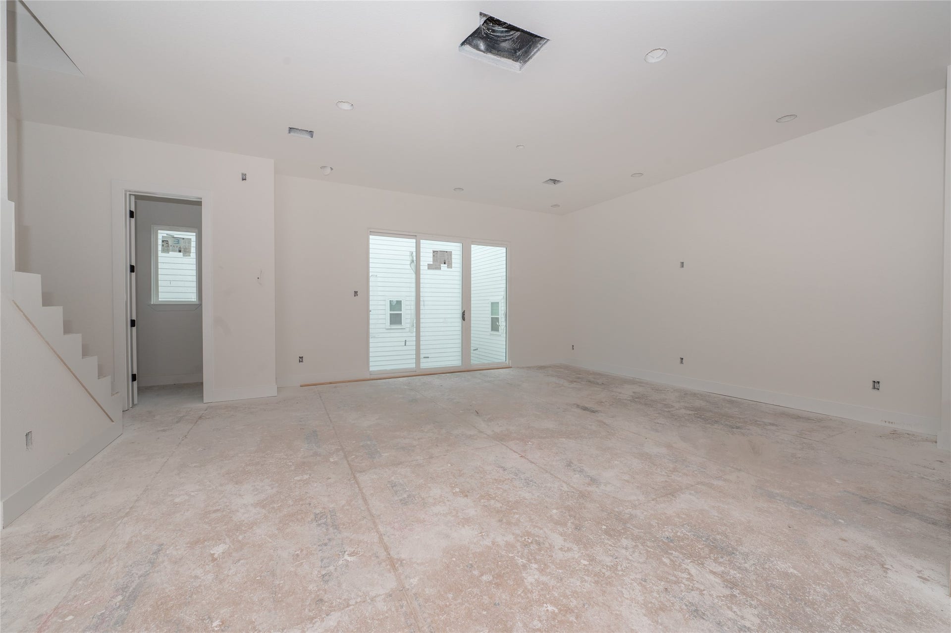 Living room with balcony and powder bath