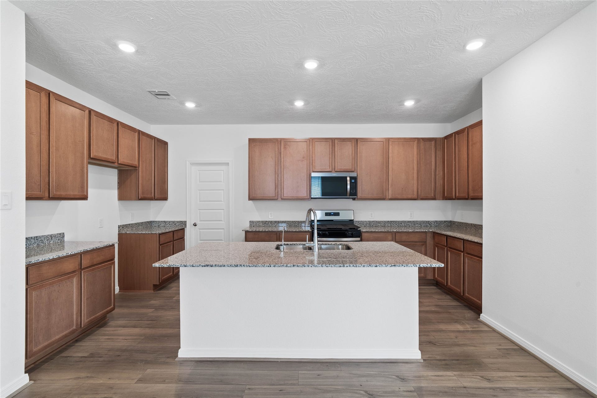 This spacious kitchen has it allample storage, generous counter space, and a layout that truly makes it the heart of the home.