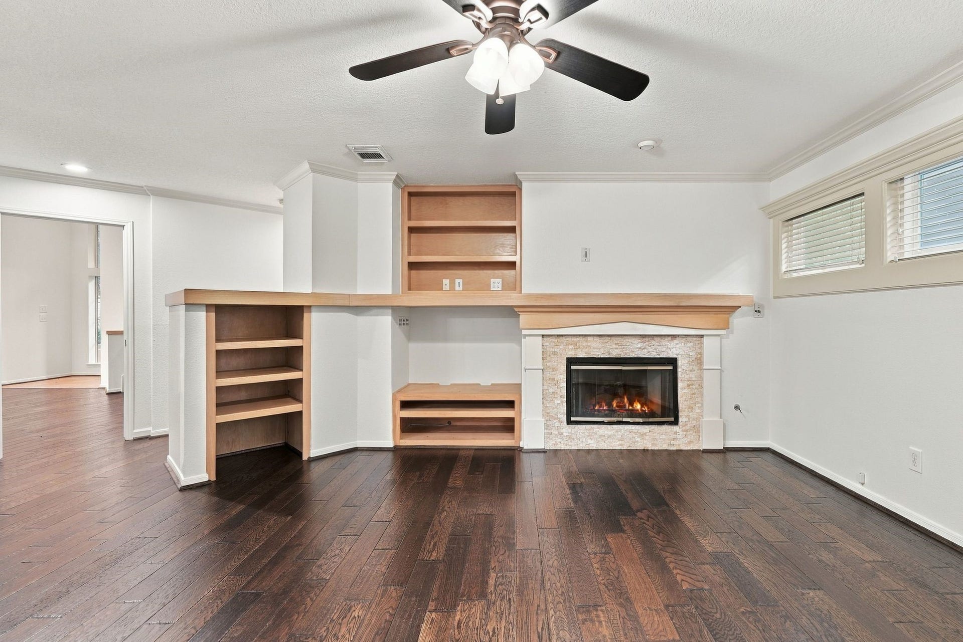 202 W Greywing Circle, The Woodlands, TX 77382 Built ins and fireplace in the den