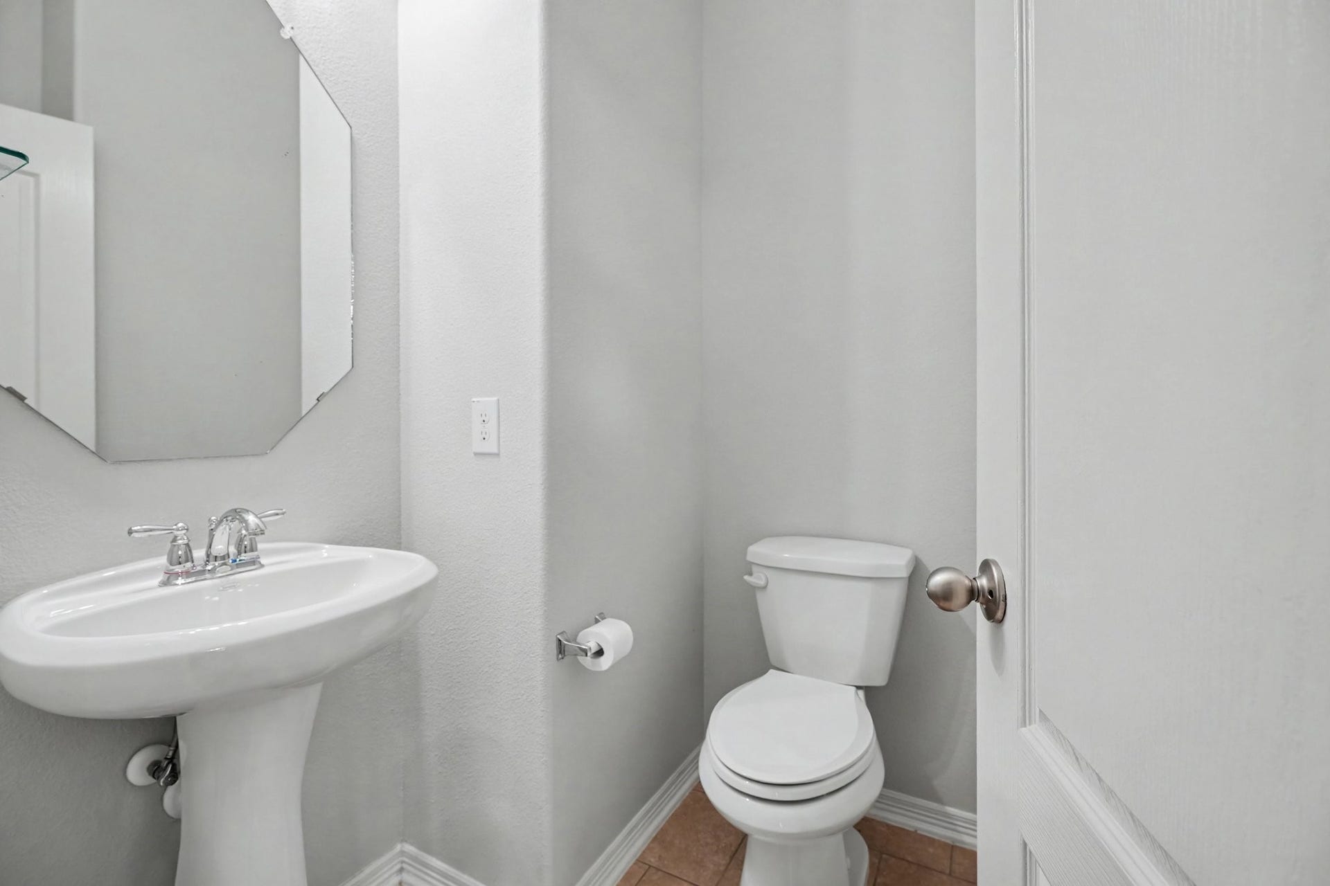 2804 Sand Dune Drive, Seabrook, TX 77586 Half bath located downstairs right around the corner from the kitchen.