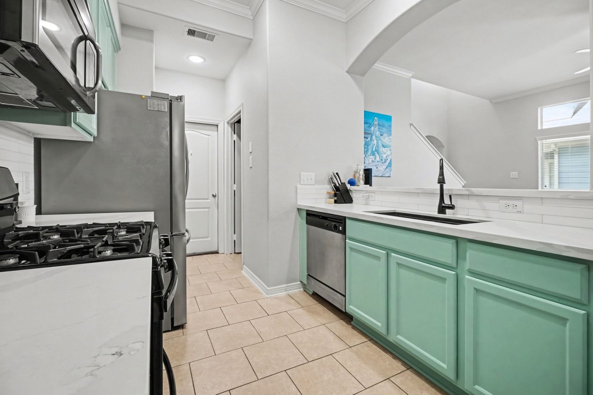 2804 Sand Dune Drive, Seabrook, TX 77586 Kitchen leads to full sized laundry room and access to the garage.