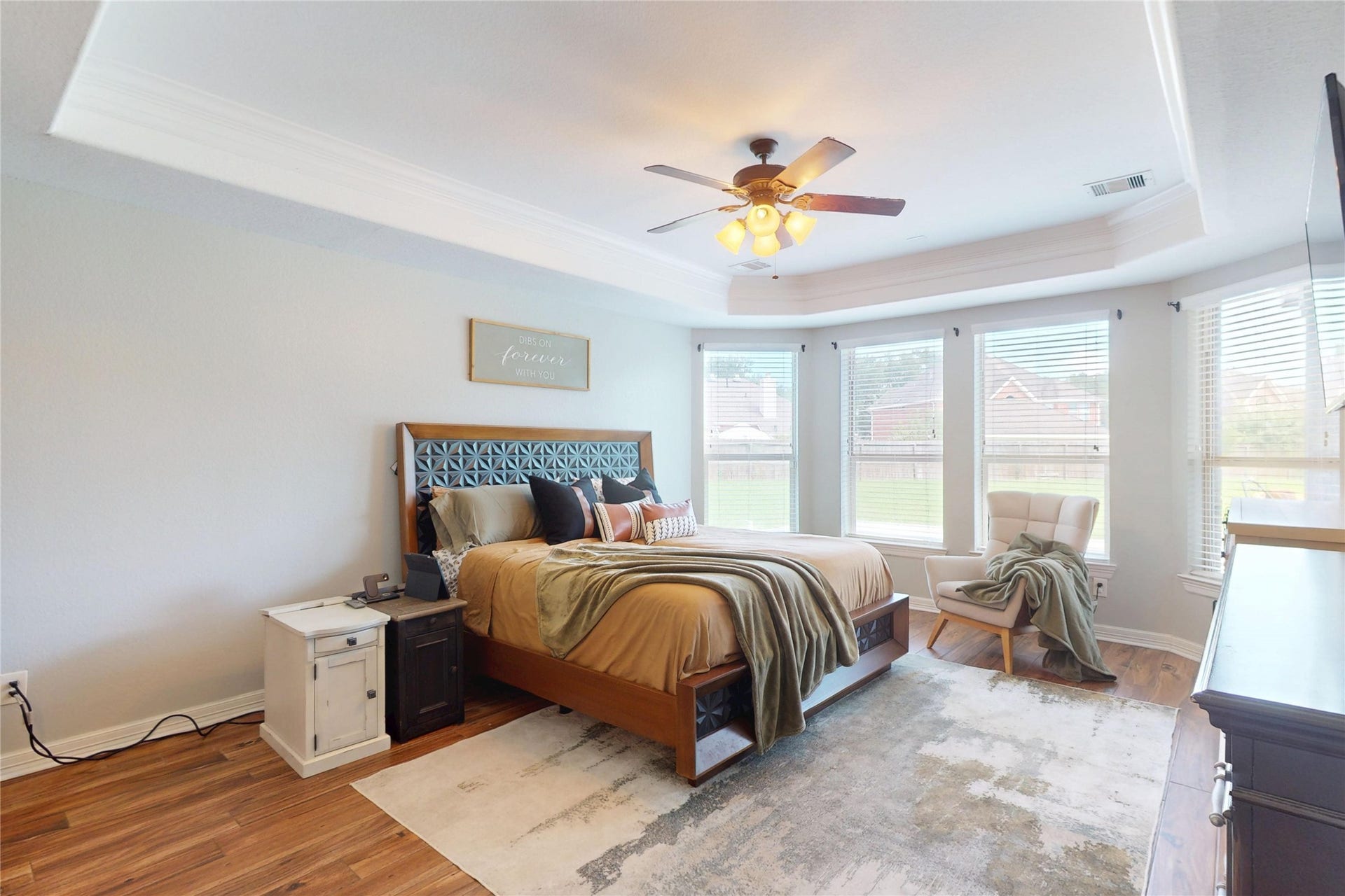 436 Old Orchard Court, Dickinson, TX 77539 Primary bedroom with tray ceiling and a bank of windows