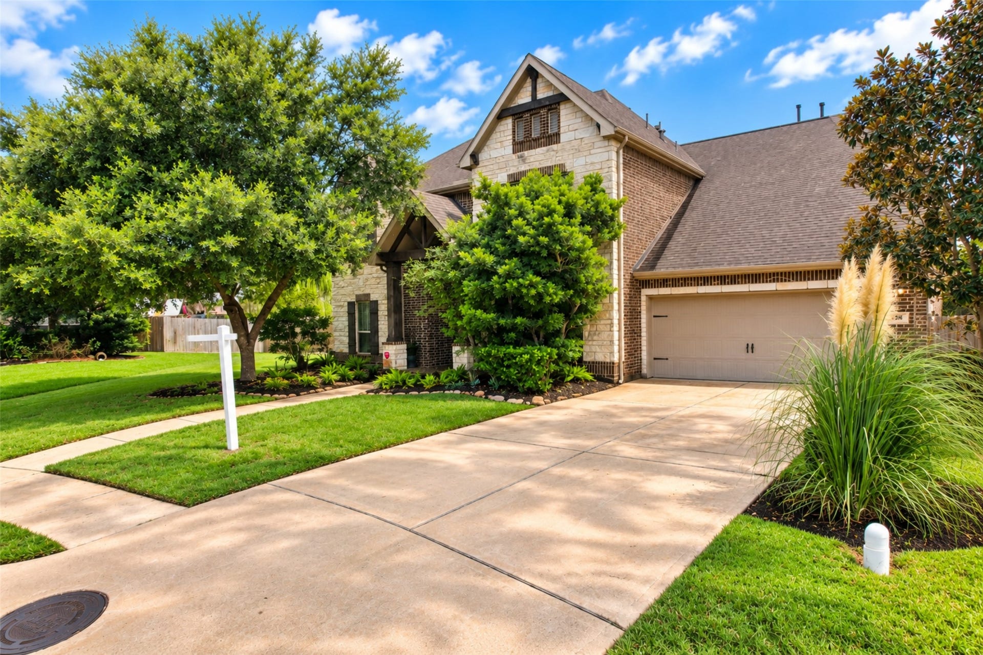 436 Old Orchard Court, Dickinson, TX 77539 Front elevation and extended driveway to the attached garage
