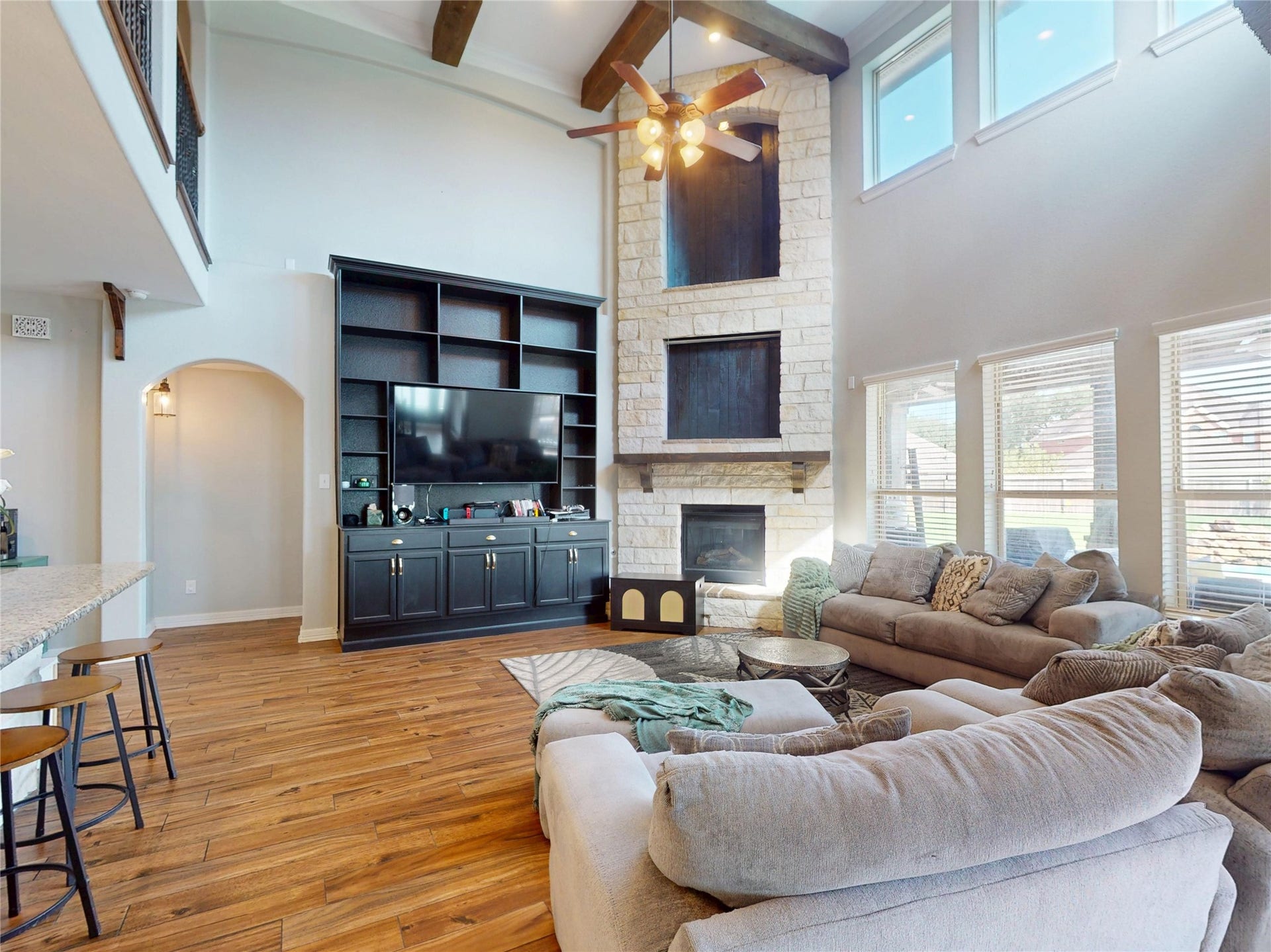 436 Old Orchard Court, Dickinson, TX 77539 Built-ins flank the fireplace beneath exposed beams