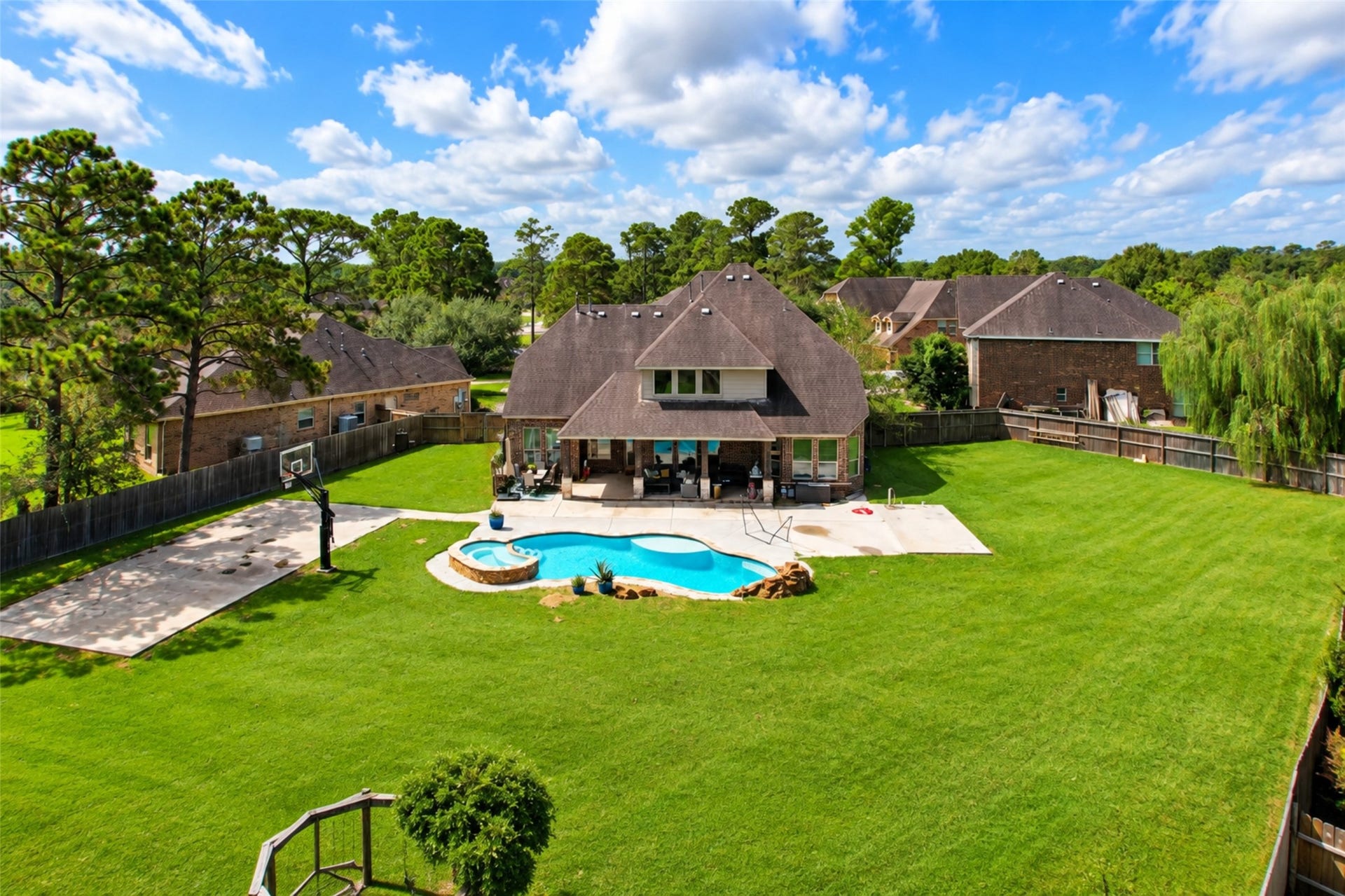 436 Old Orchard Court, Dickinson, TX 77539 Aerial of the rear - pool, spa and oversized fenced yard