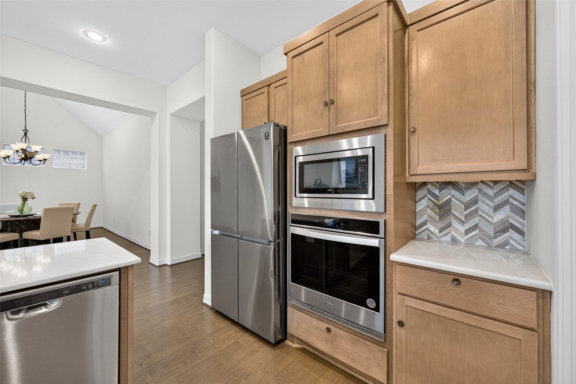 10706 Hazel Hills Drive, Cypress, TX 77433 Modern stainless steel appliances seamlessly integrate into the cabinetry, offering performance and sleek appeal for the home chef.