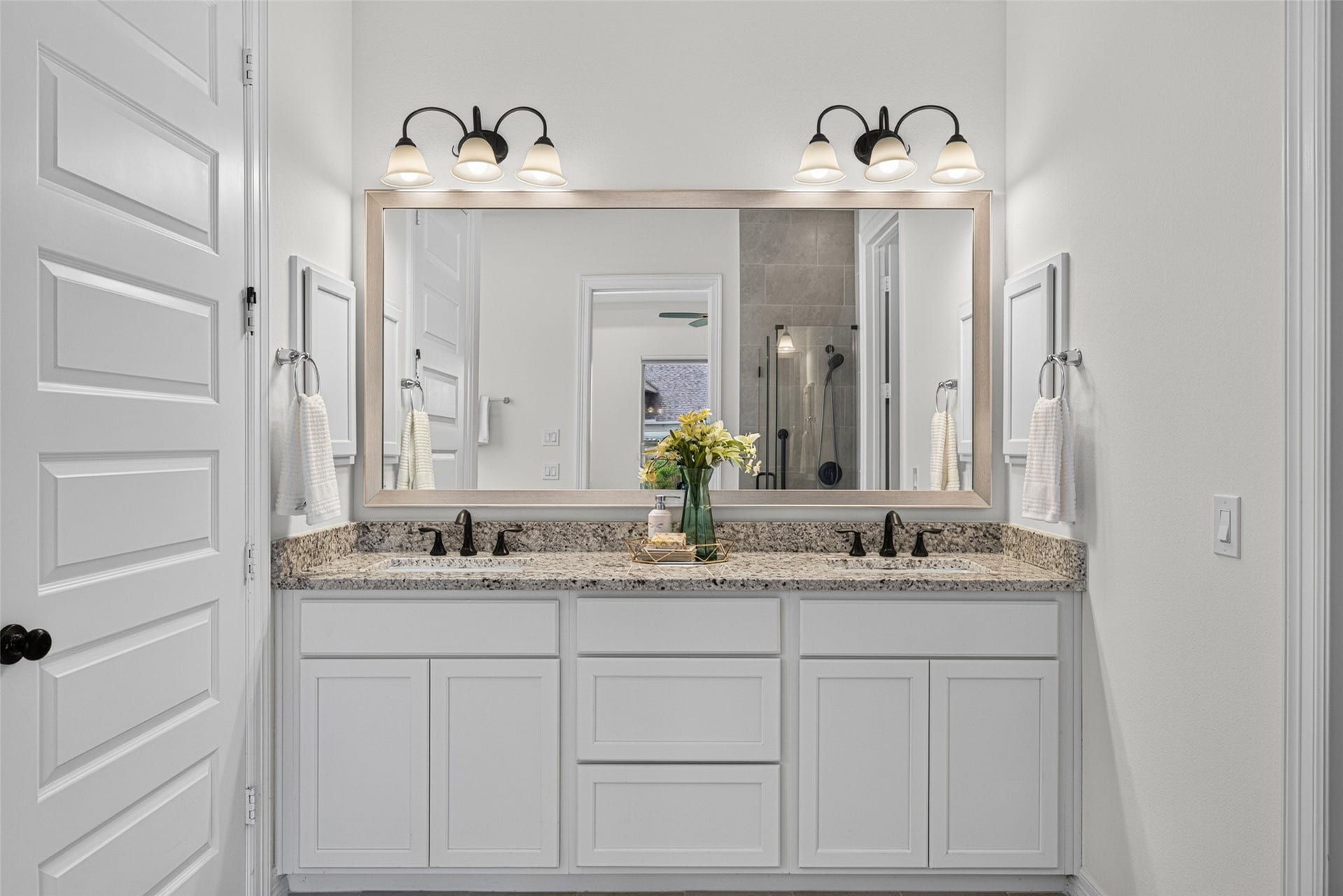 10706 Hazel Hills Drive, Cypress, TX 77433 Step into a private spa-like haven designed for total relaxation and self-care. The sleek vanity area features ample counter space and storage, making morning routines effortlessly smooth for two.