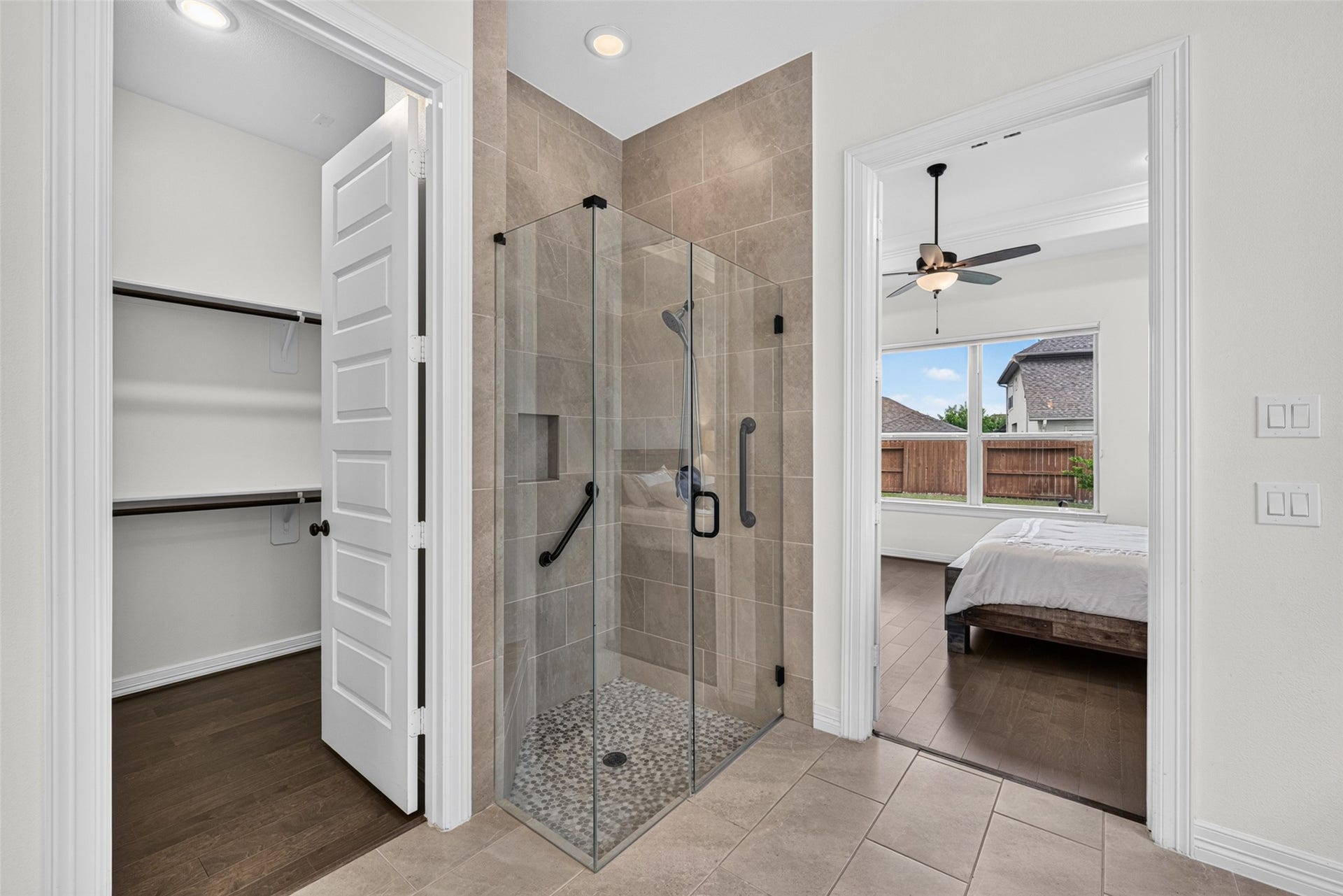 10706 Hazel Hills Drive, Cypress, TX 77433 Enjoy a daily spa experience in the spacious walk-in shower, finished with clean lines and modern tile work.