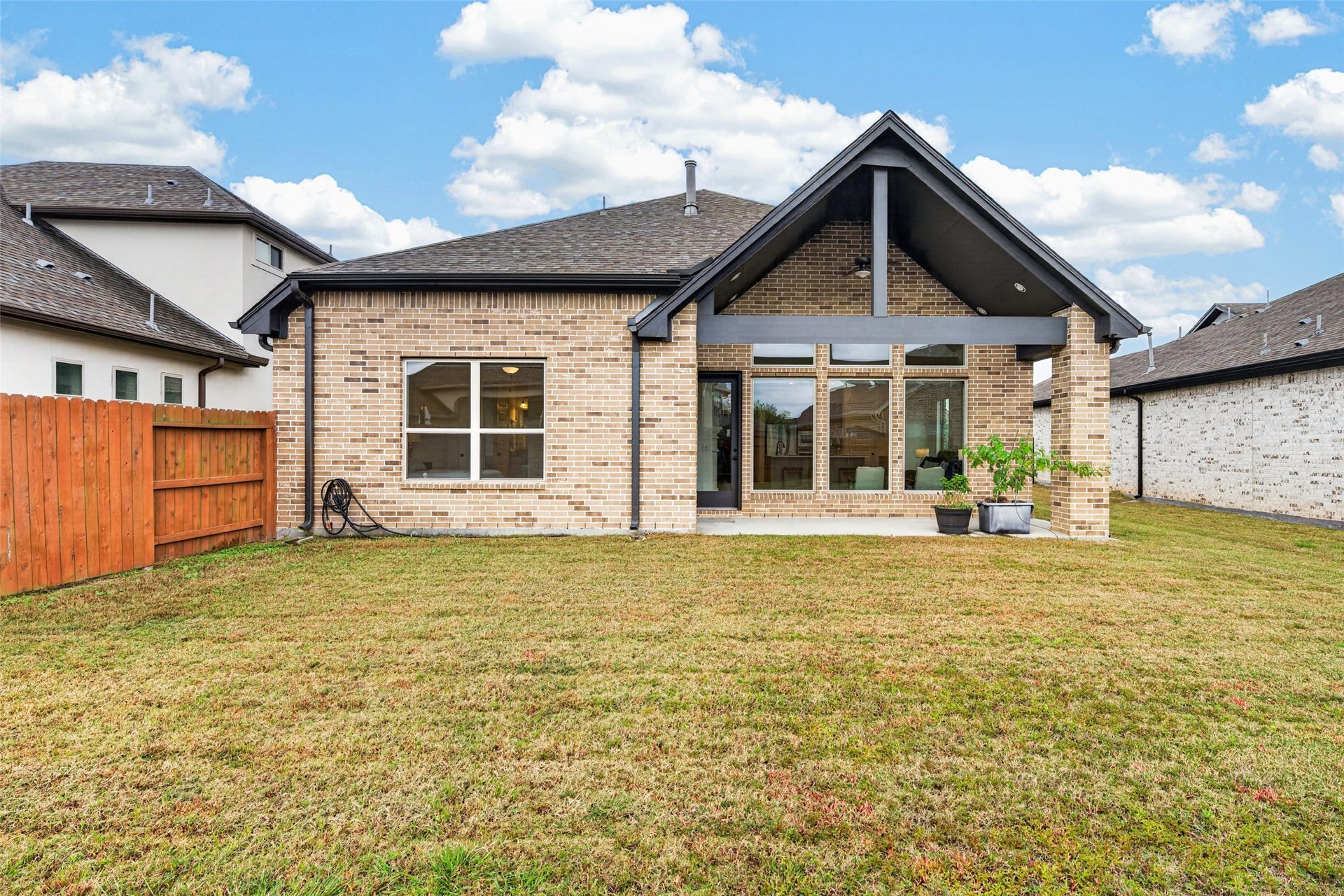 10706 Hazel Hills Drive, Cypress, TX 77433 Perfectly designed for al fresco dining, morning coffees, or casual evening lounging, it offers a sheltered sanctuary to enjoy the outdoors in any weather.