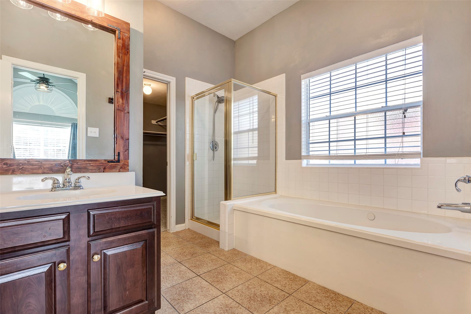 11514 Tara Place, Pearland, TX 77584 En Suite bath offers separate glass shower and jetted tub under a lovely widow