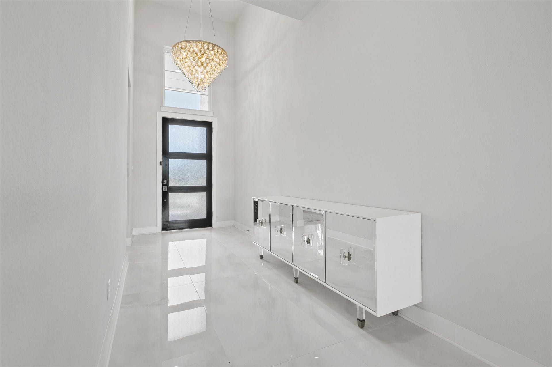 Upon entering you're greeted with white porcelain marble flooring in the common areas and custom chandeliers.
