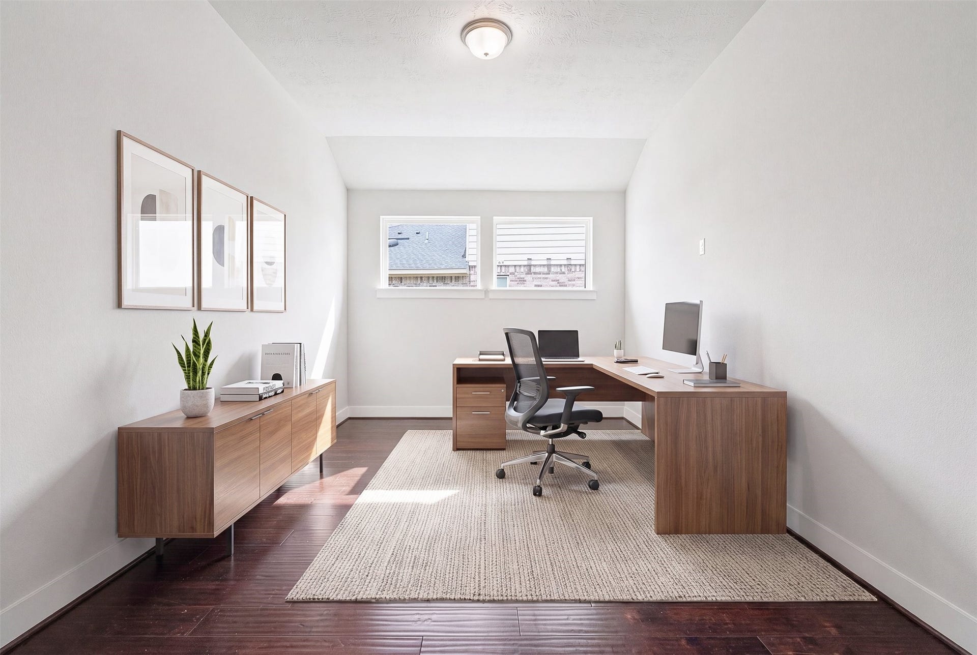 This beautifully designed home office showcases rich wood flooring, sun-filled windows, and classic dome lighting, creating the perfect blend of style and functionality for working from home. *Virtually staged