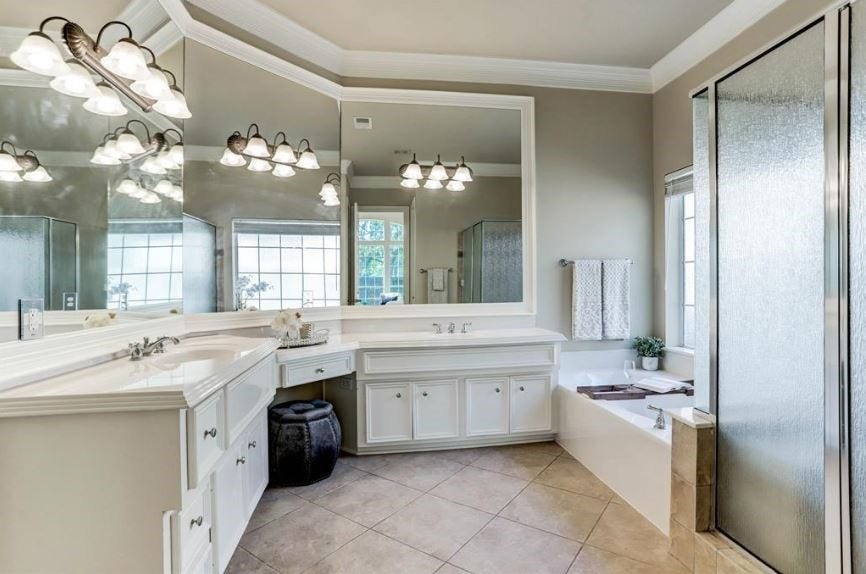 2722 Tahoe Basin, Missouri City, TX 77459 Master bathroom with double sinks, jacuzzi, and standing shower.