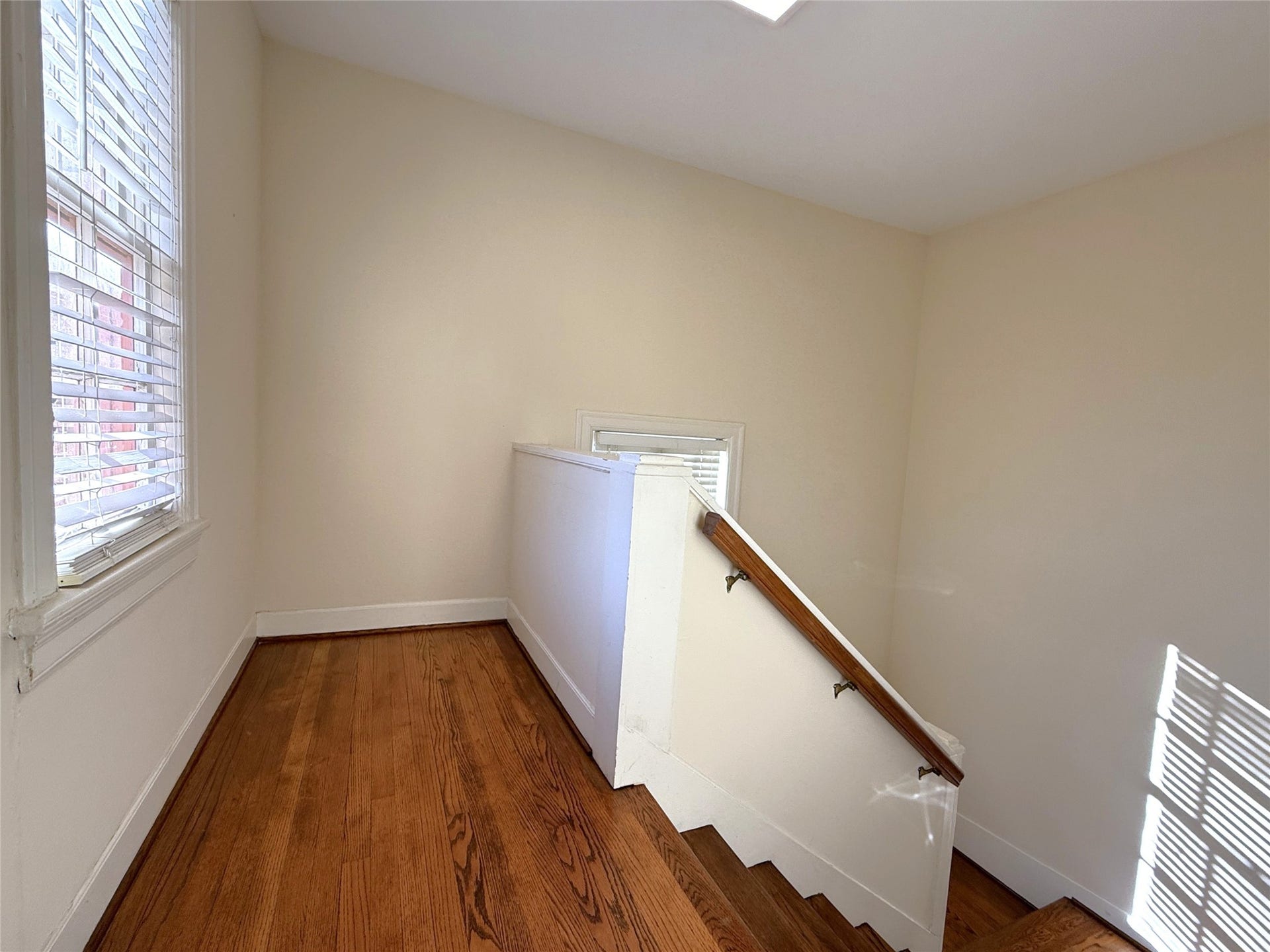1968 Dryden Road, #2, Houston, TX 77030 From two windows, natural light flows into the stairway leading up to unit #2