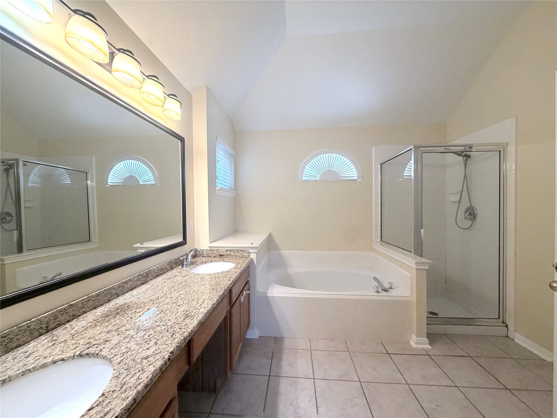12211 Meadow Crest Court, Meadows Place, TX 77477 Primary bath with double vanities, separate tub and shower