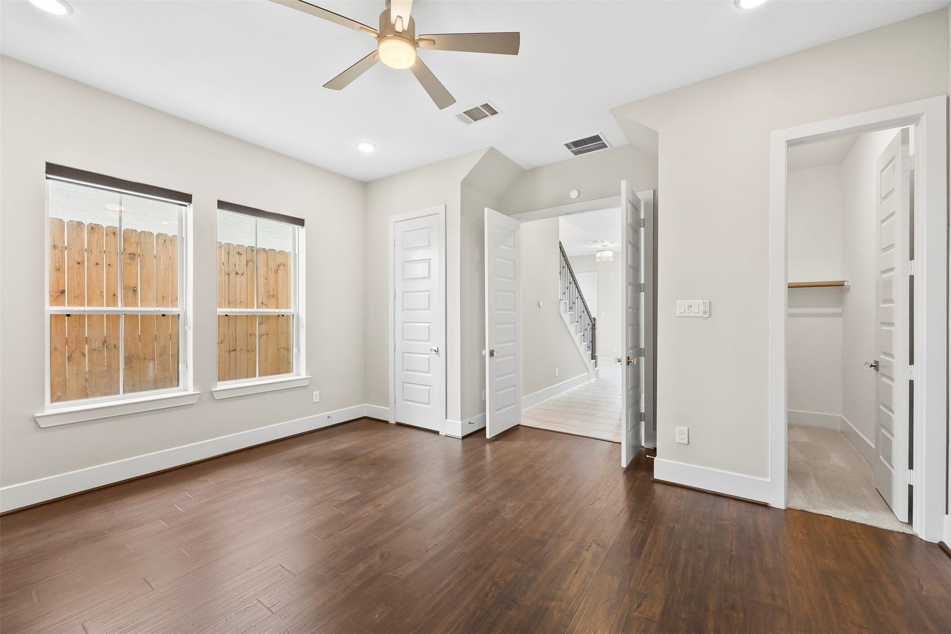Additional view of the first-floor guest suite showcasing natural light and generous room dimensions.