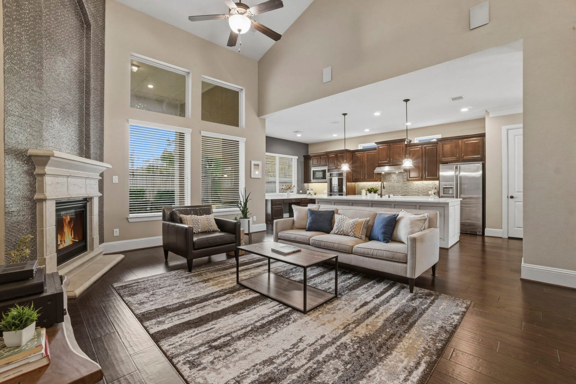 75 W Sawyer Ridge Drive, The Woodlands, TX 77389 This home boasts 3,299 sqft of premium living space. Family room is open to the kitchen.