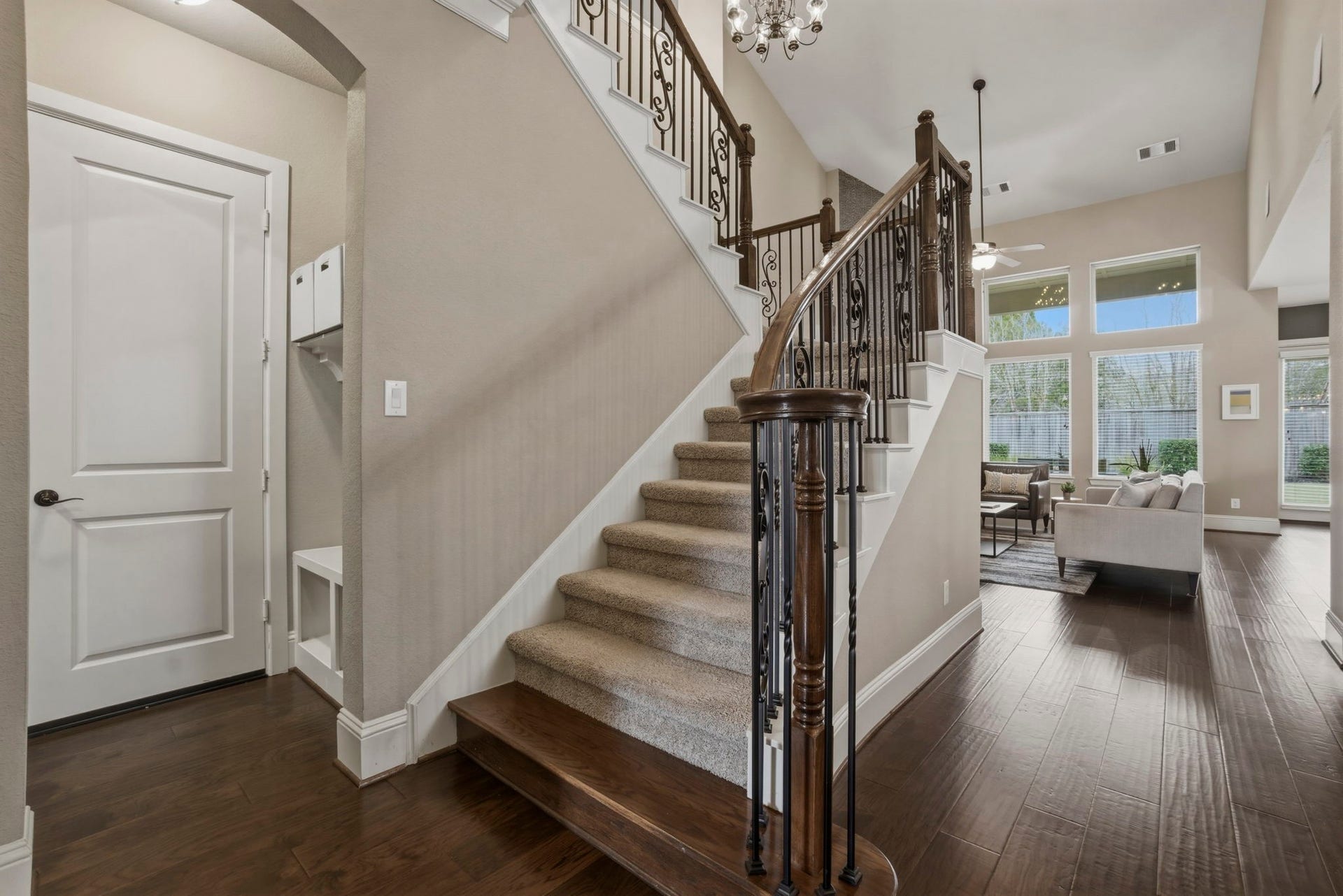 75 W Sawyer Ridge Drive, The Woodlands, TX 77389 To the left of the staircase is a storage nook and the door to the 3 car garage.