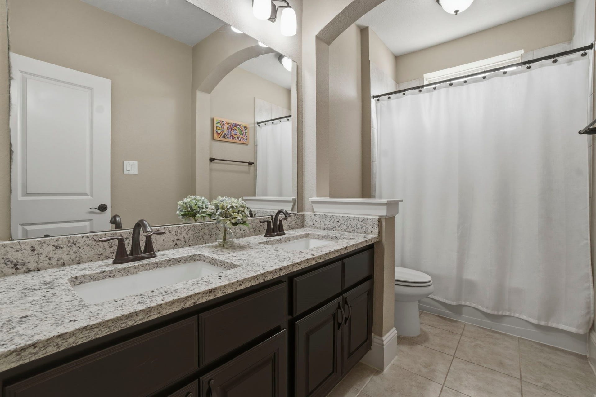 75 W Sawyer Ridge Drive, The Woodlands, TX 77389 Full bathroom #3 with double sinks, granite countertops and a shower/tub combo.