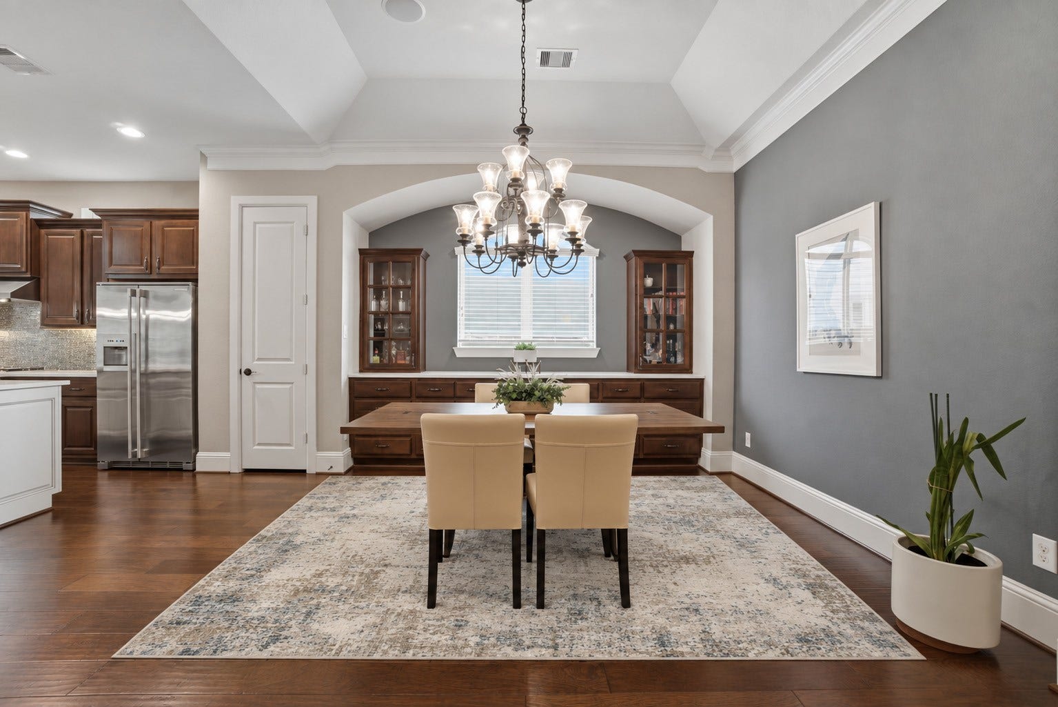 75 W Sawyer Ridge Drive, The Woodlands, TX 77389 Dining room with updated lighting and gorgeous builtin cabinetry.