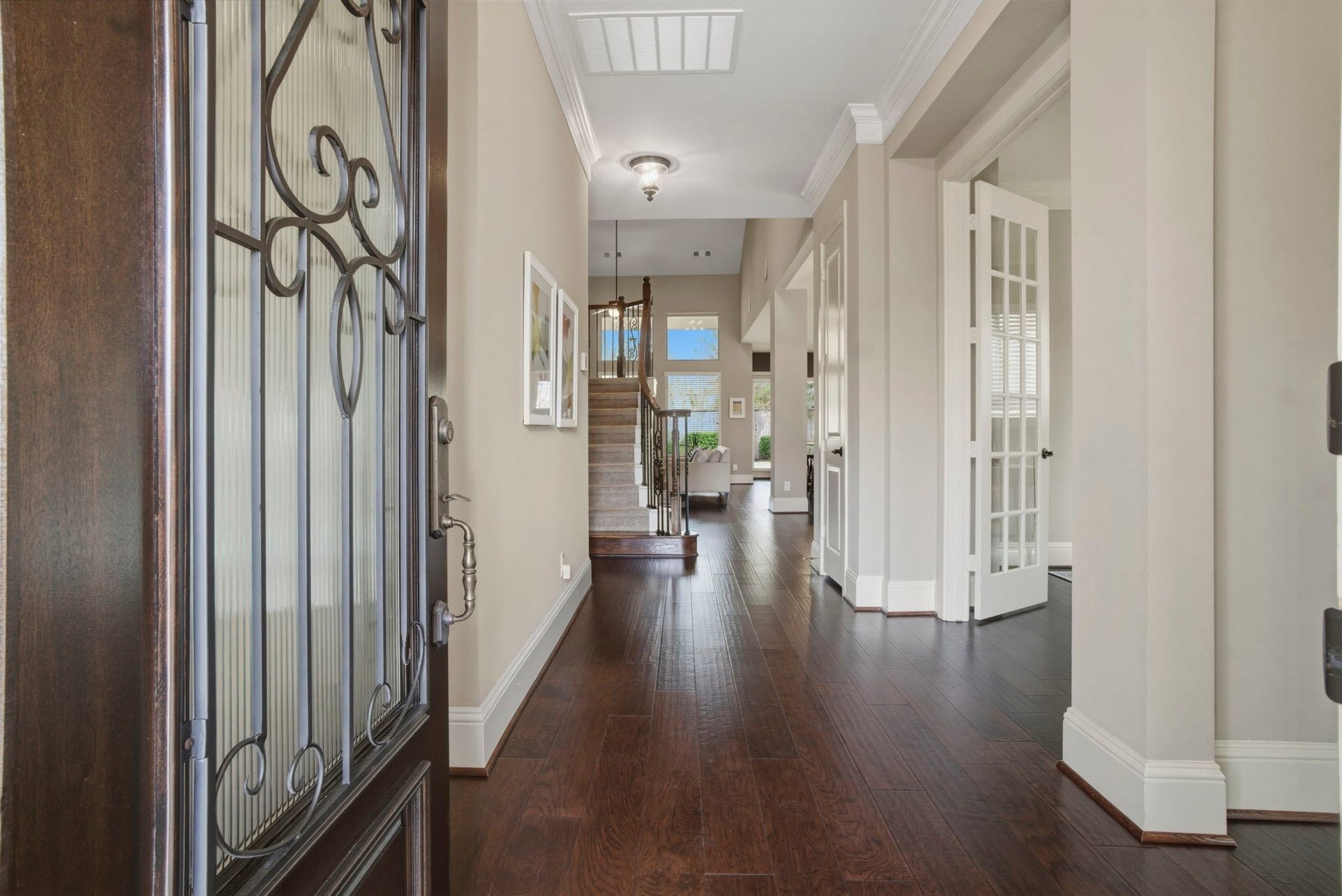 75 W Sawyer Ridge Drive, The Woodlands, TX 77389 Crown molding elevates this living space along with the new hand-scraped wood flooring throughout the first floor.