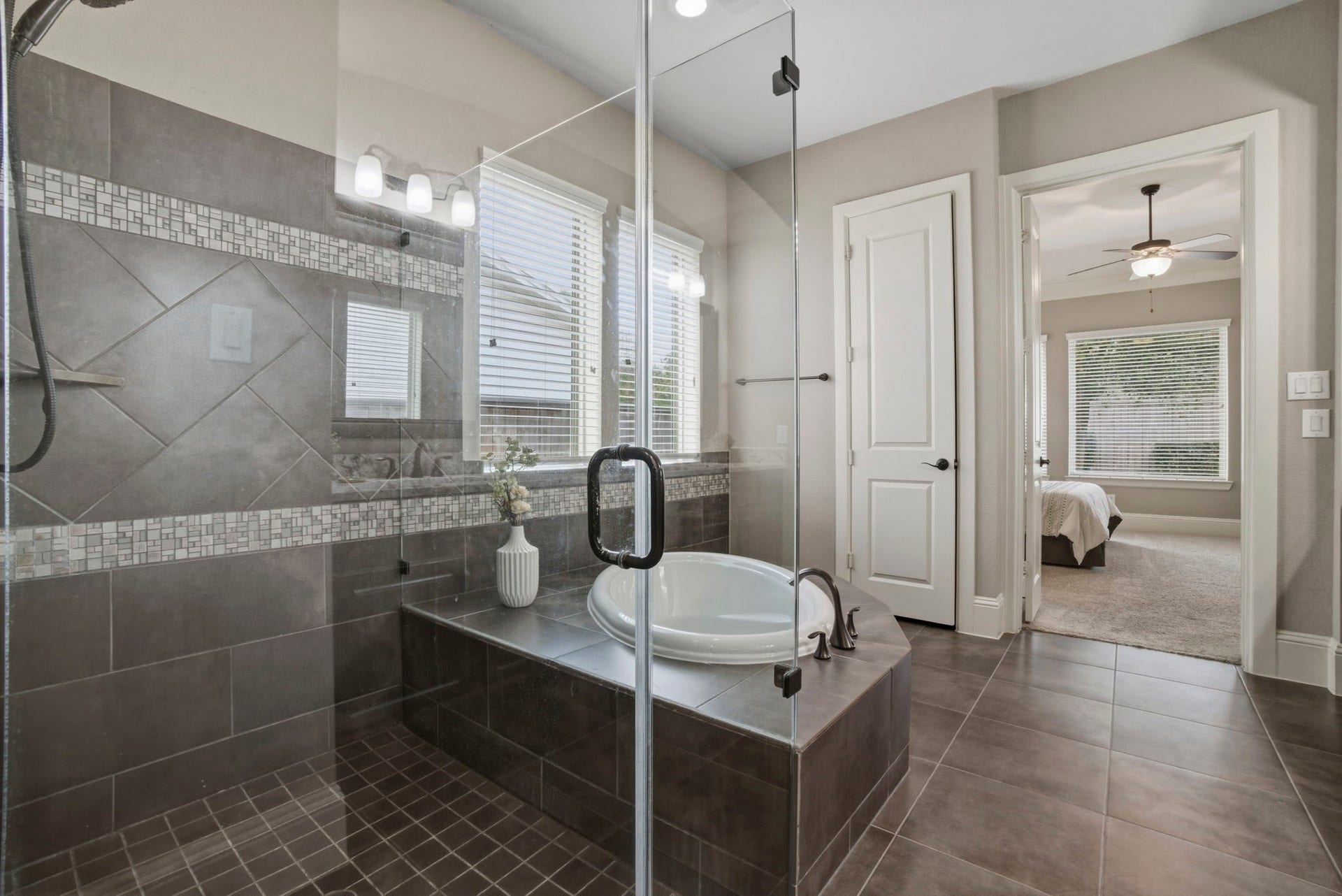 75 W Sawyer Ridge Drive, The Woodlands, TX 77389 Primary bath with an oversized walk in shower and separate soaking tub.