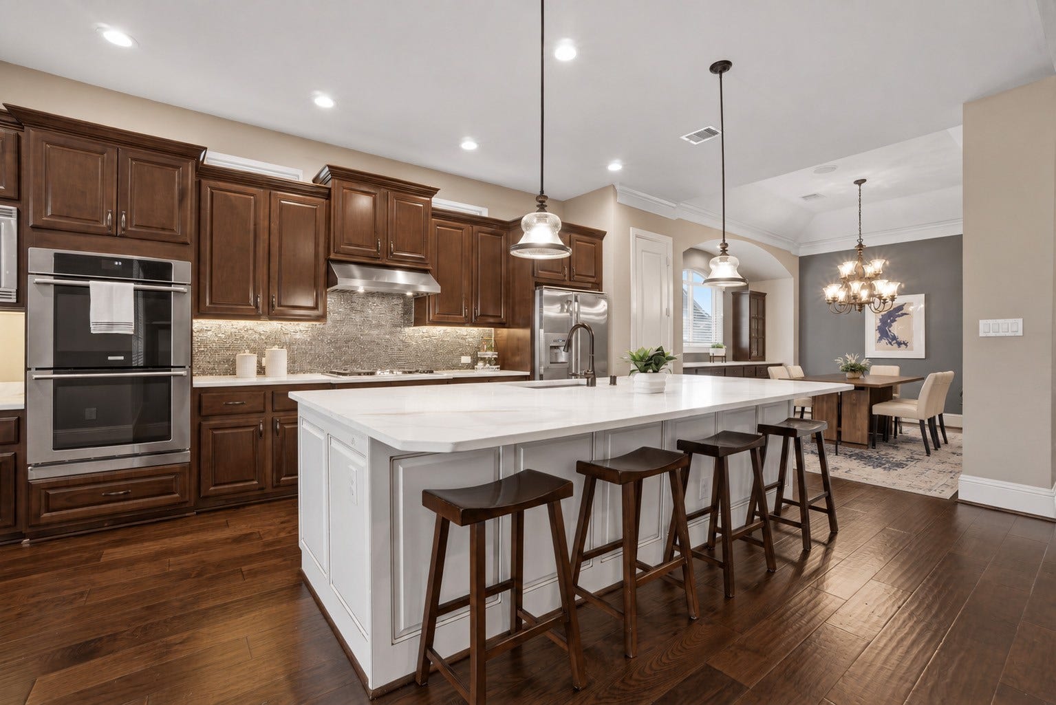 75 W Sawyer Ridge Drive, The Woodlands, TX 77389 The kitchen island comfortably seats 4 and is perfect for entertaining or breakfast seating.